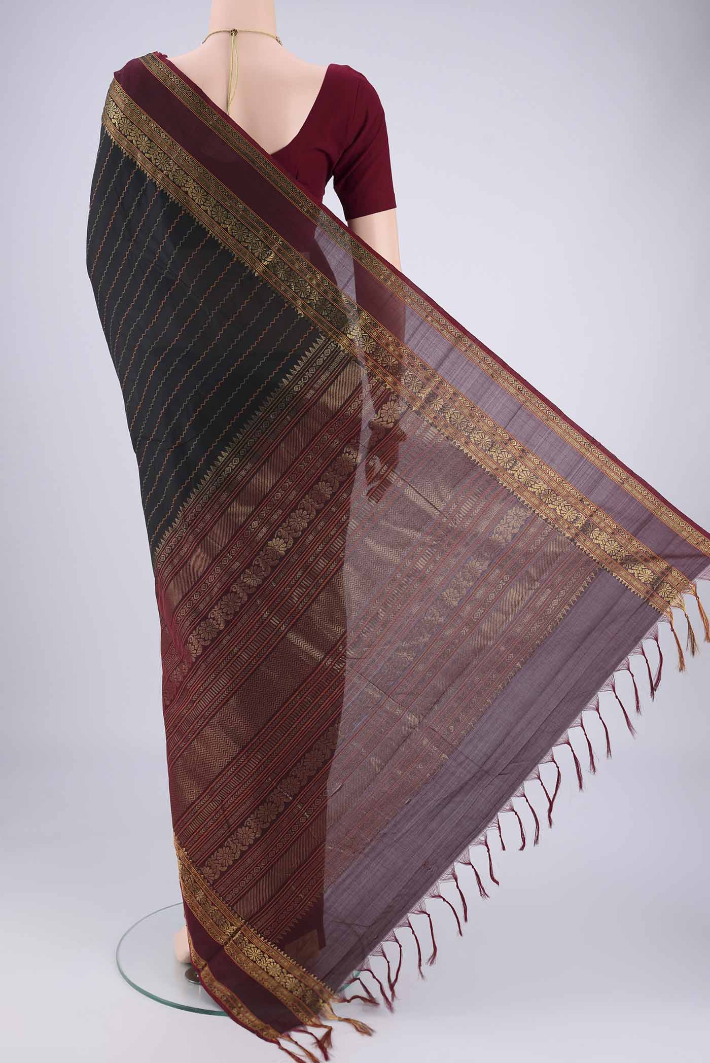 Flat view of Black Blended Poly Cotton Saree with Veldhari on the body and Zari Border. 