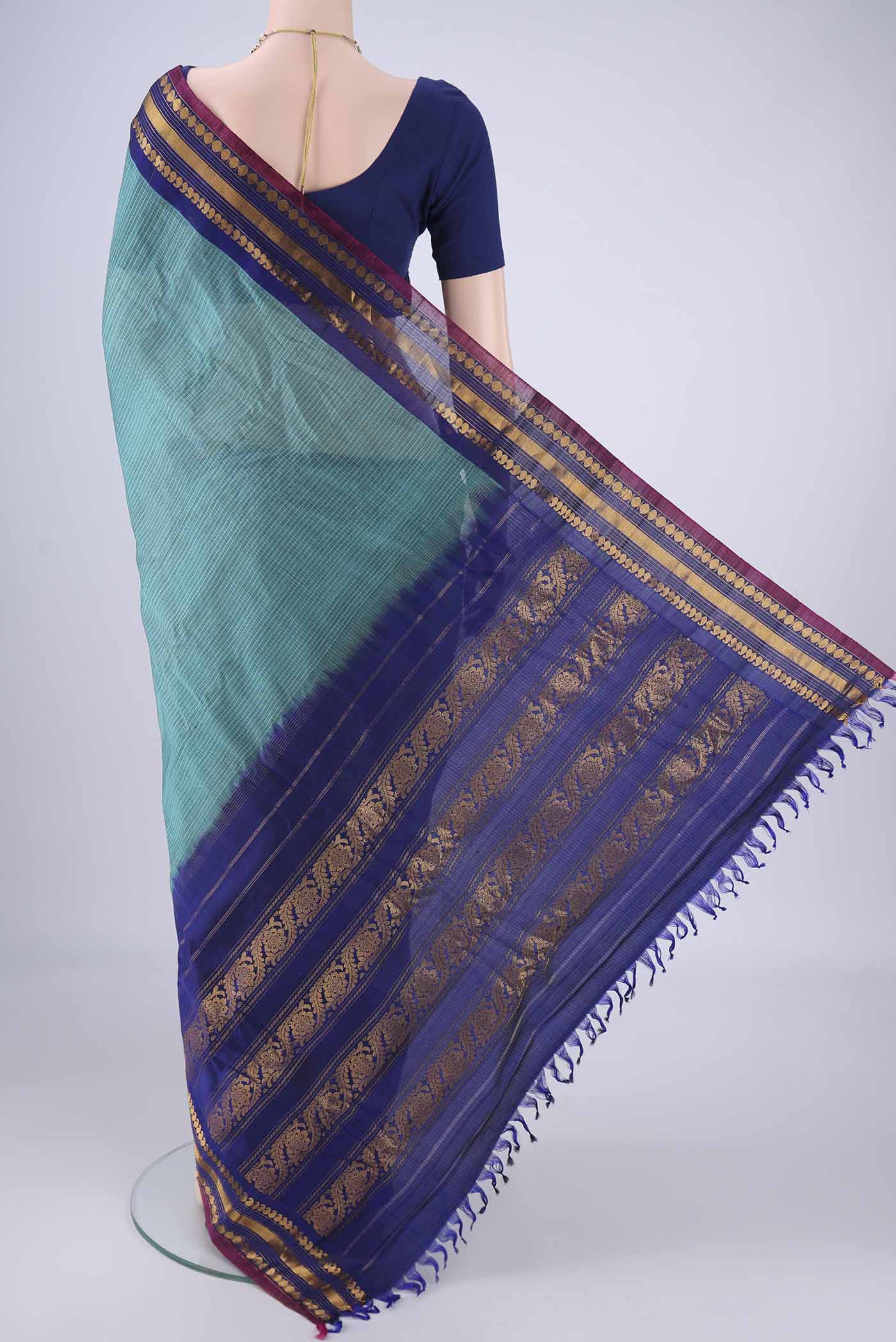 Flat view of Sea Green Gadwal Silk Cotton Saree with Checked design on the body and Silk Border. 