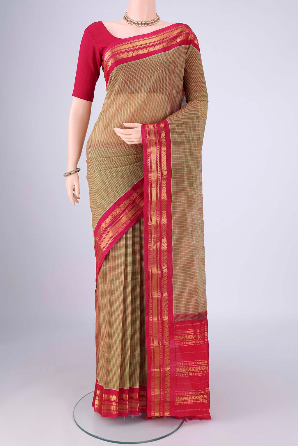 Mehandi Green Gadwal Silk Cotton Saree with Checked design on the body and Silk Border.  displayed on a mannequin
