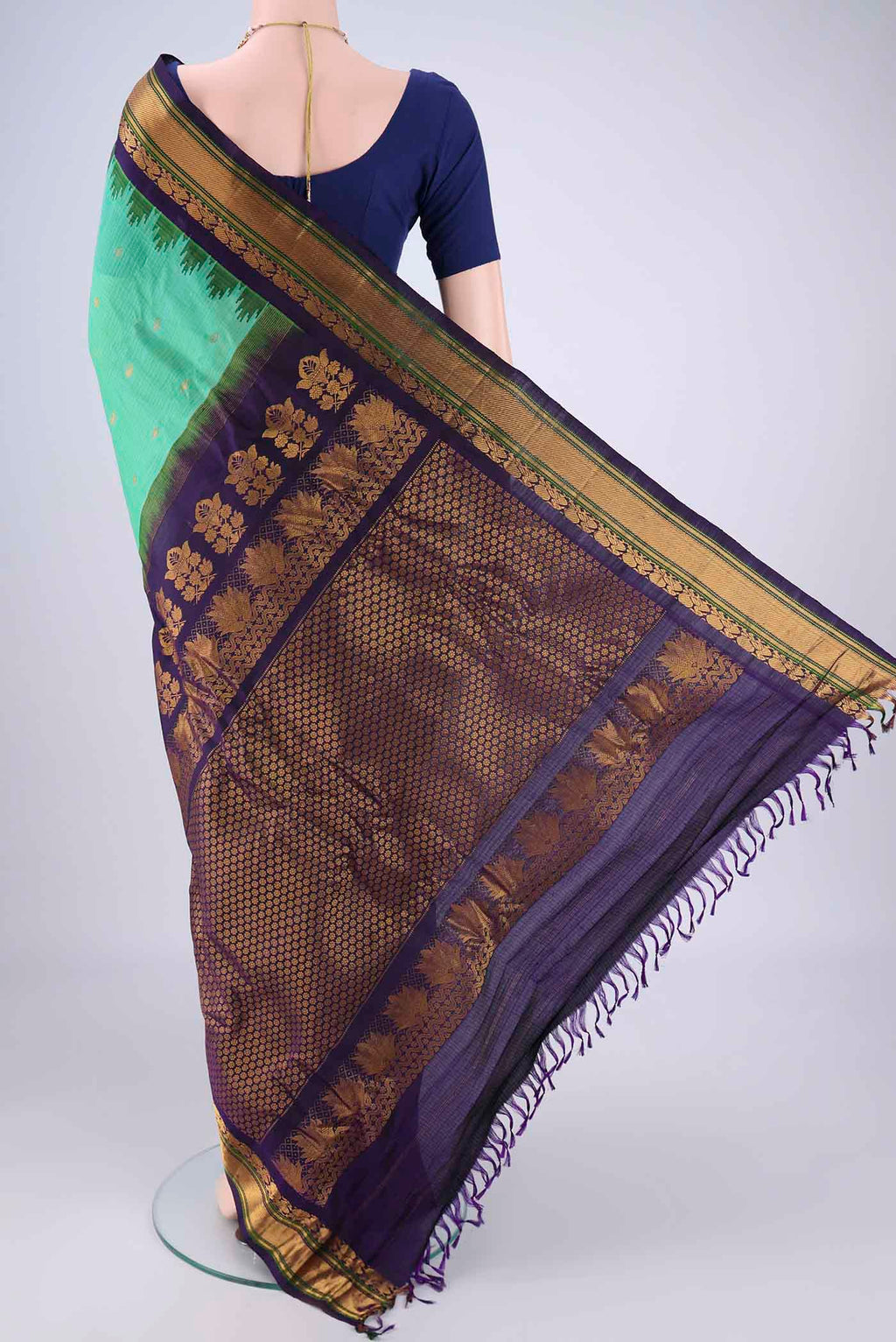 Flat view of Sea Green Gadwal Silk Cotton Saree with Zari Butta on the body and Silk Border. 