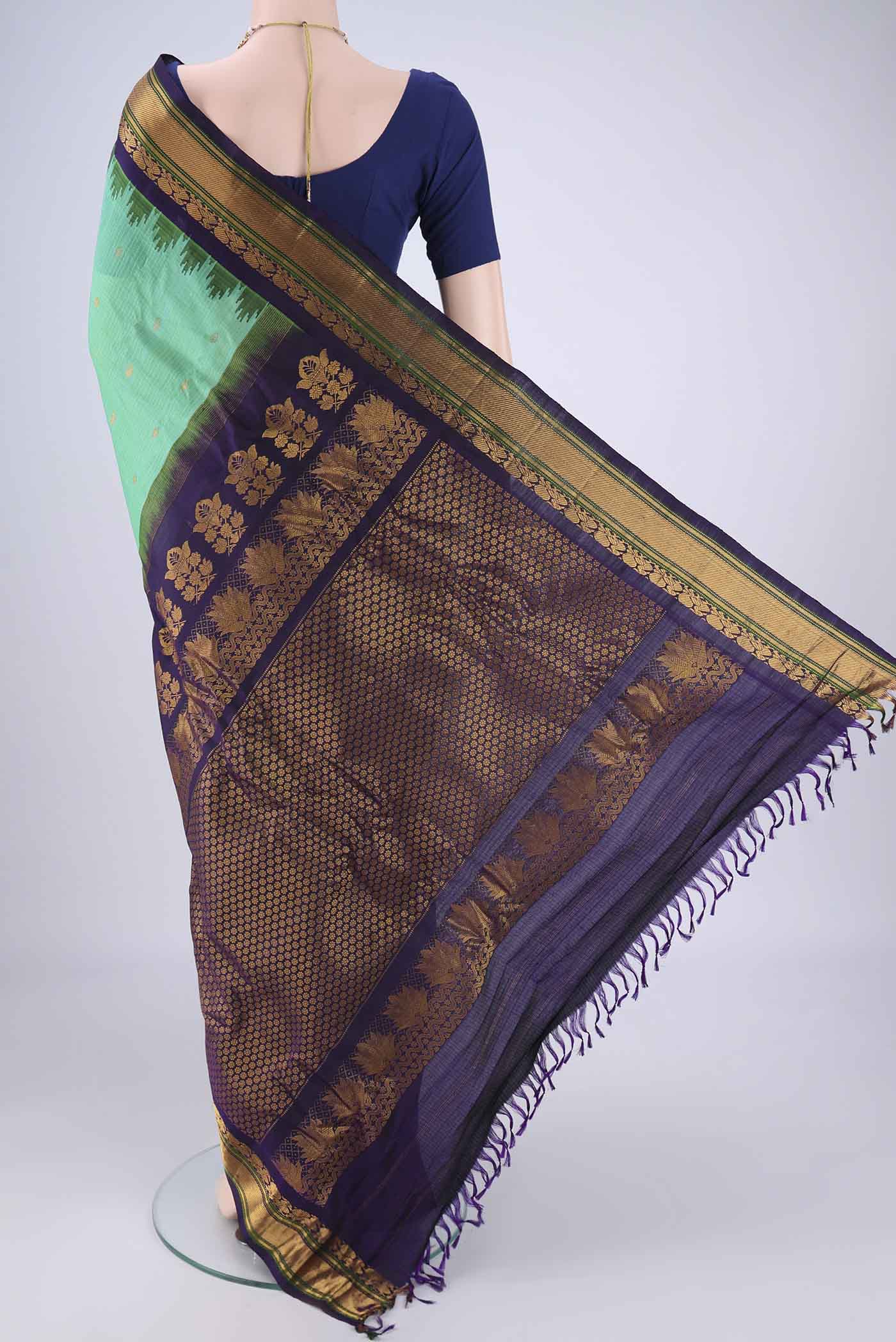 Flat view of Sea Green Gadwal Silk Cotton Saree with Zari Butta on the body and Silk Border. 