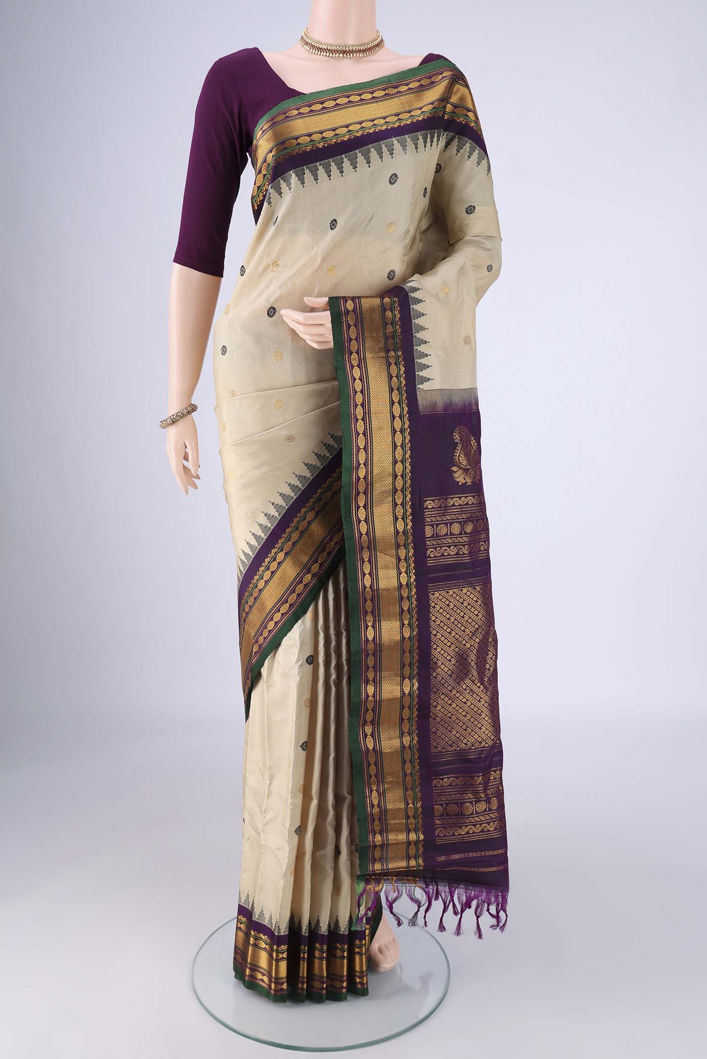 Beige Gadwal Silk Saree with Zari Butta on the body and Zari Border.  displayed on a mannequin