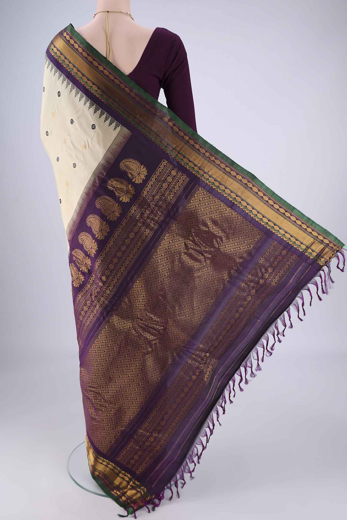 Flat view of Beige Gadwal Silk Saree with Zari Butta on the body and Zari Border. 