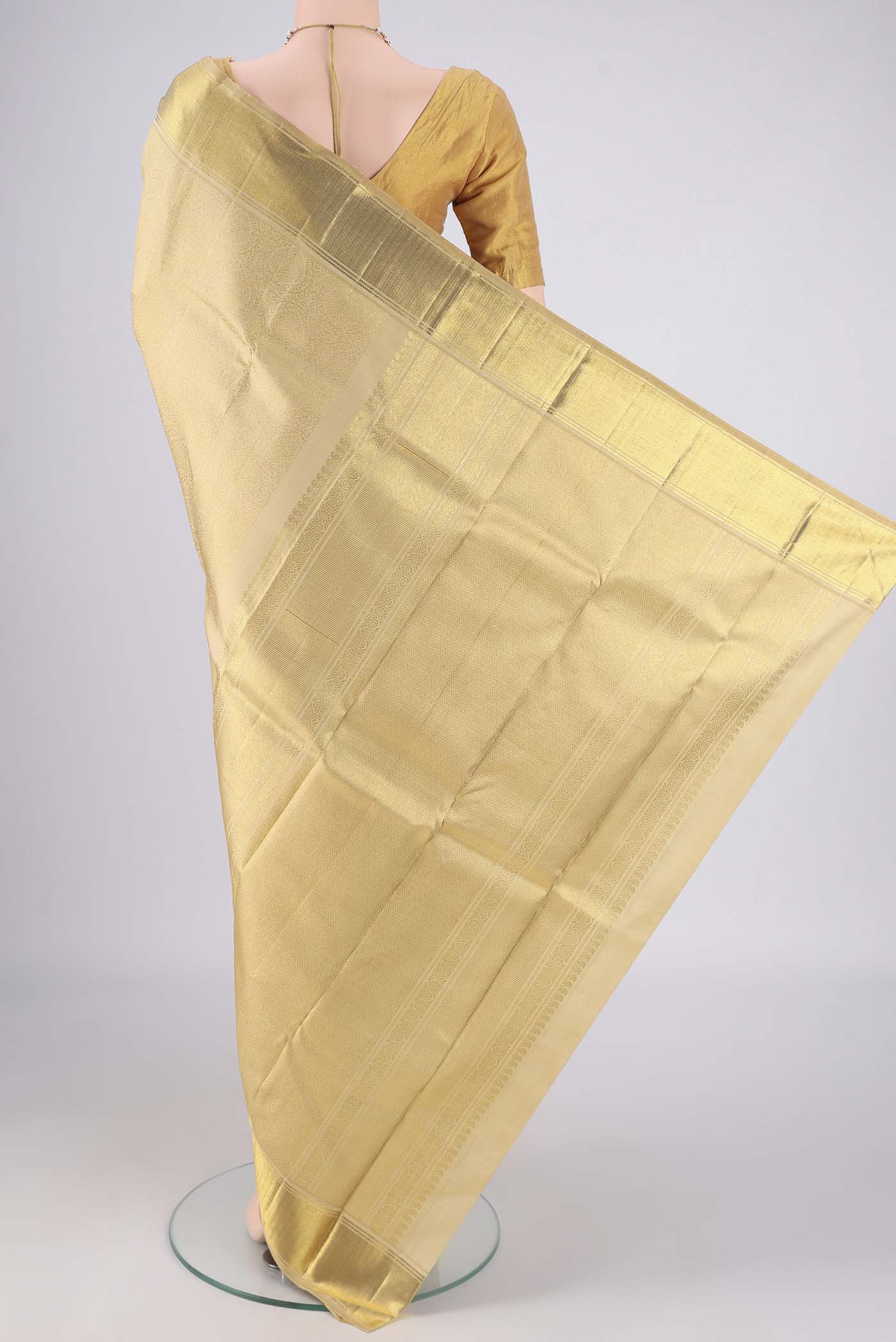 Flat view of Pure Silk Pure Zari Beige Kanjivaram Saree with Zari Brocade on the body and Zari Border. 