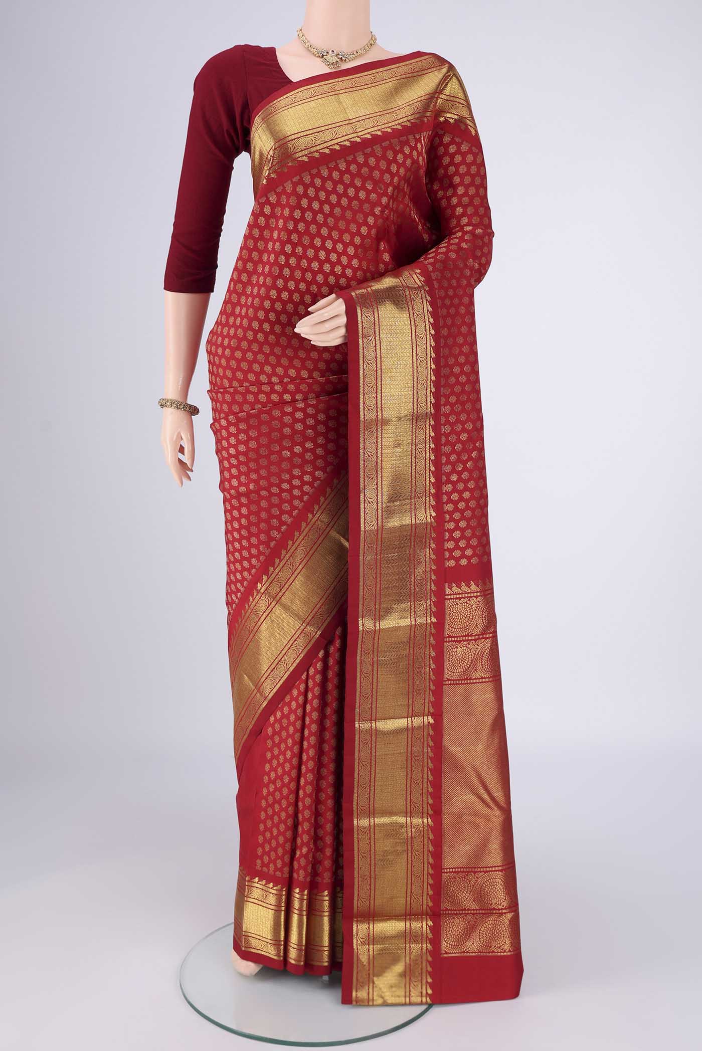 Pure Silk Pure Zari Red Kanjivaram Saree with Zari Brocade on the body and Zari Border.  displayed on a mannequin