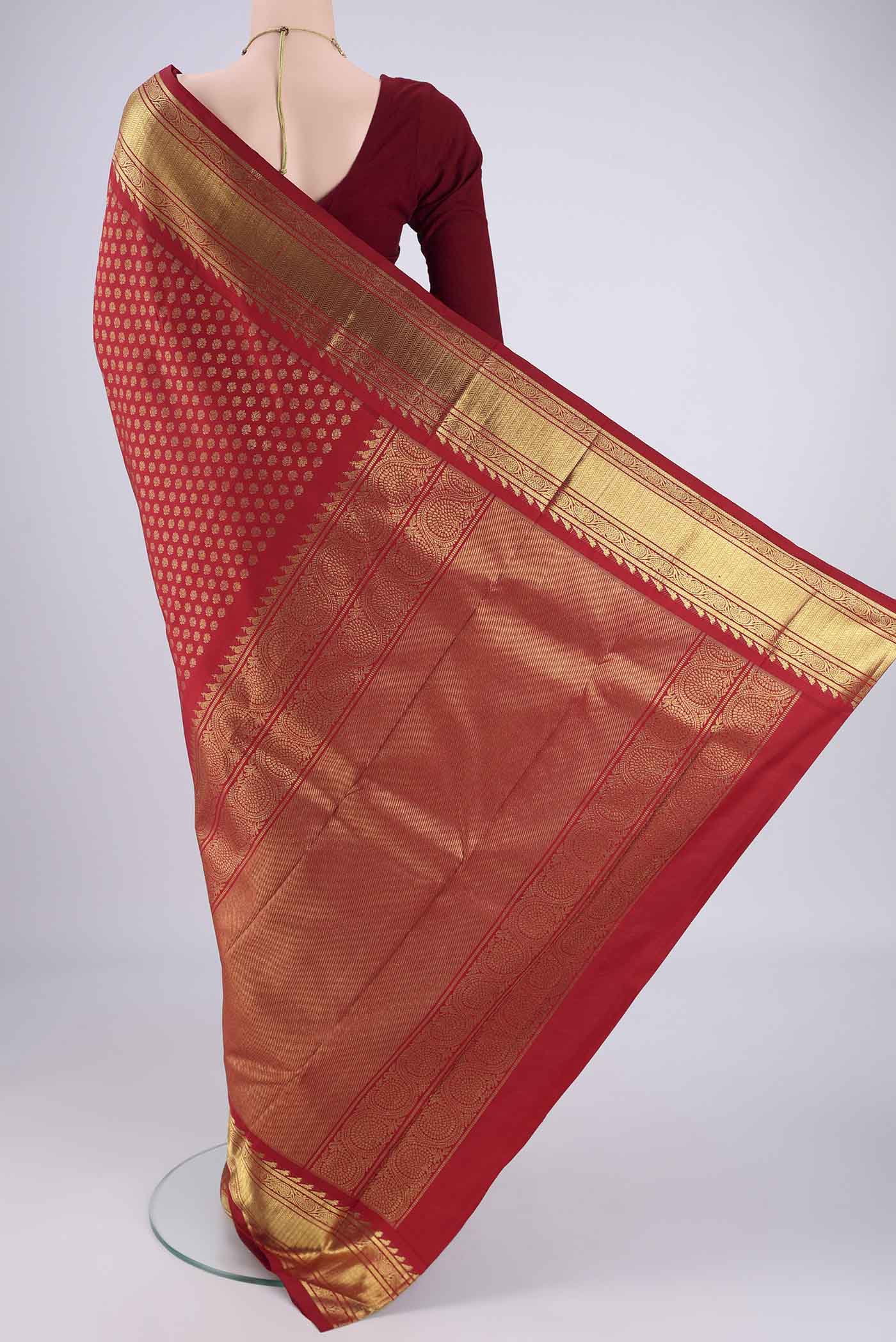 Flat view of Pure Silk Pure Zari Red Kanjivaram Saree with Zari Brocade on the body and Zari Border. 