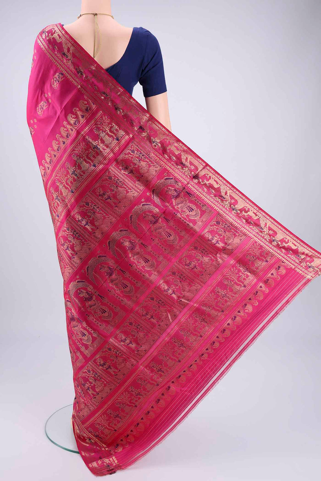 Flat view of Rani Pink Baluchari Silk Saree with Zari And Thread Butta on the body and Zari And Thread Border. 
