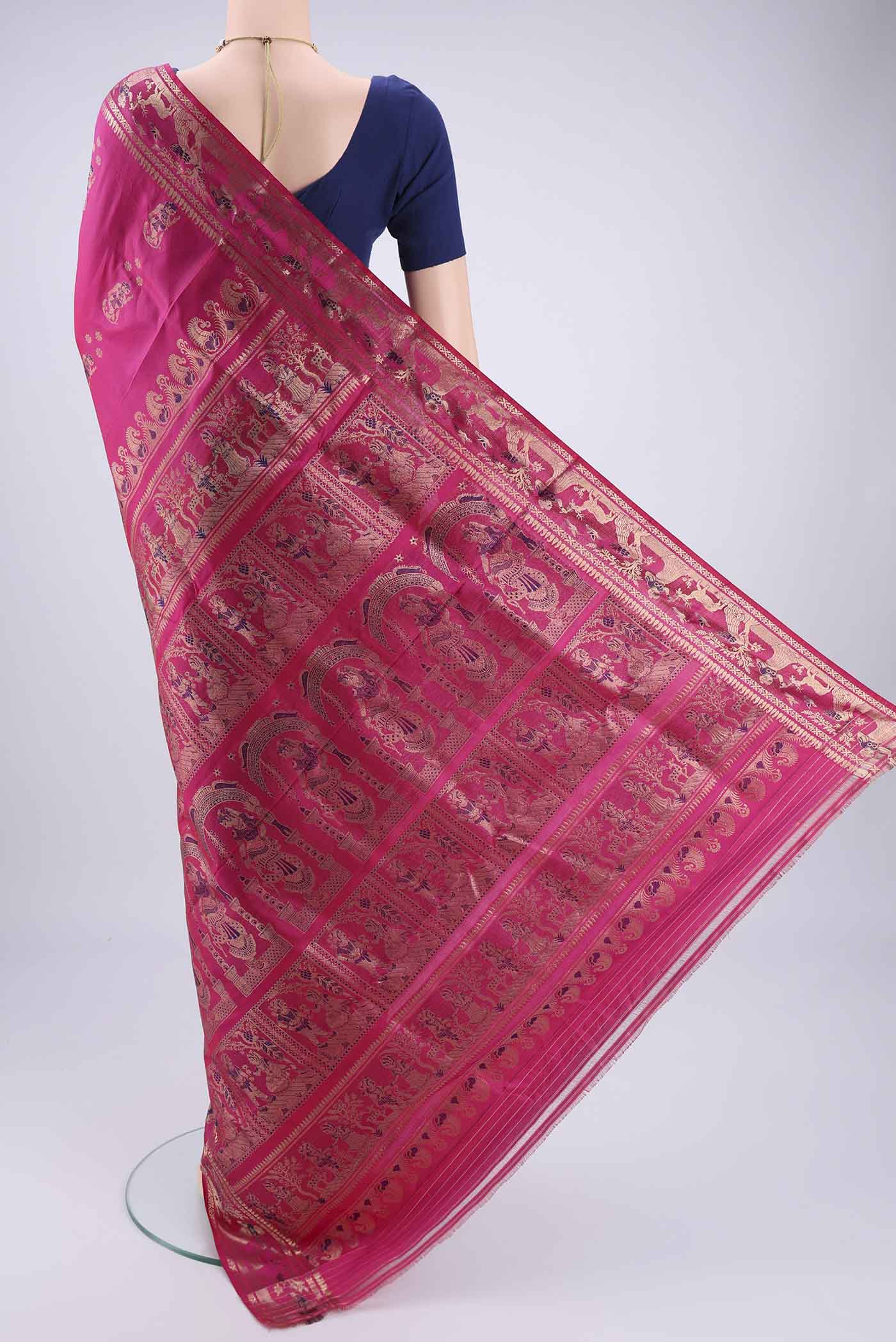 Flat view of Rani Pink Baluchari Silk Saree with Zari And Thread Butta on the body and Zari And Thread Border. 