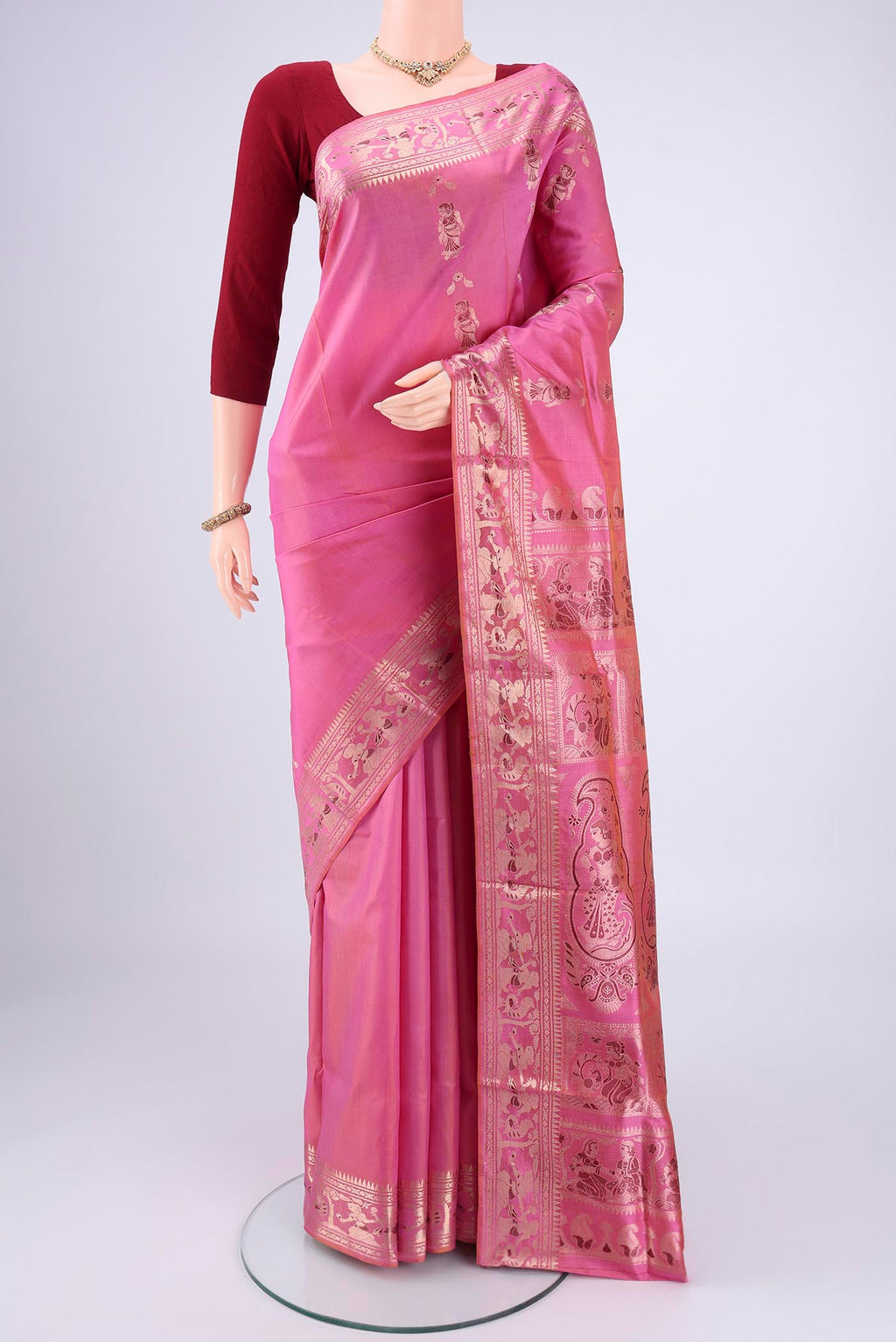 Pink Baluchari Silk Saree with Zari And Thread Butta on the body and Zari And Thread Border.  displayed on a mannequin