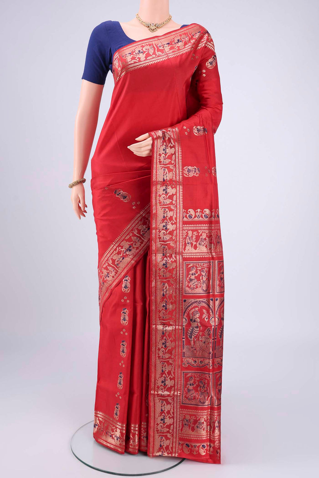 Red Baluchari Silk Saree with Zari And Thread Butta on the body and Zari And Thread Border.  displayed on a mannequin