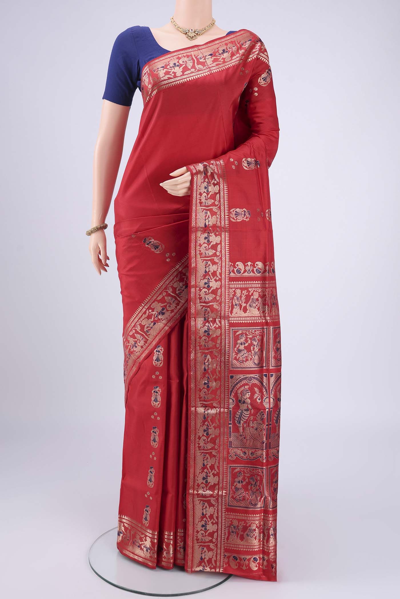Red Baluchari Silk Saree with Zari And Thread Butta on the body and Zari And Thread Border.  displayed on a mannequin