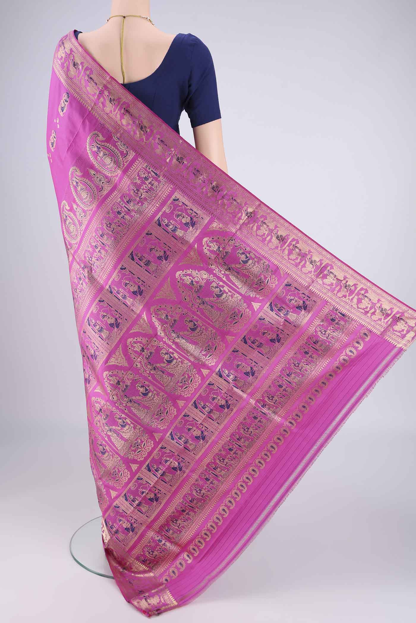 Flat view of Pink Baluchari Silk Saree with Zari And Thread Butta on the body and Zari And Thread Border. 