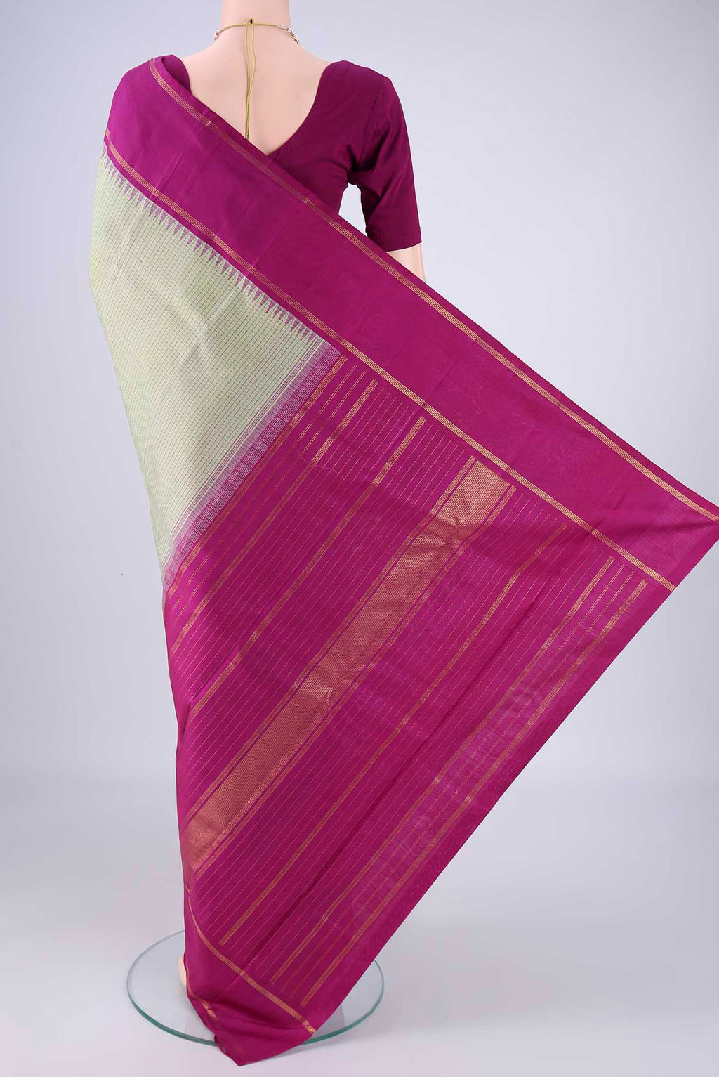 Flat view of Pista Green Kanchipuram Silk Saree with Checked design on the body and Plain Border. 