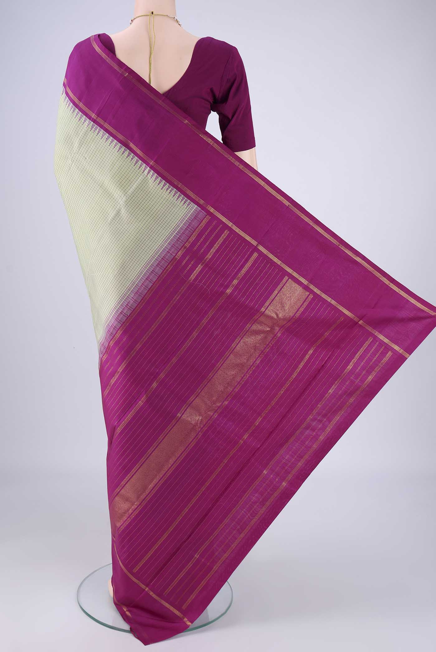 Flat view of Pista Green Kanchipuram Silk Saree with Checked design on the body and Plain Border. 