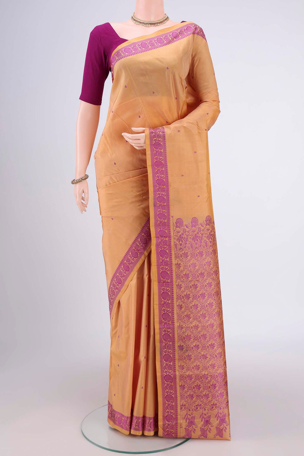Sandal Kanchipuram Silk Saree with Thread Butta on the body and Thread Border.  displayed on a mannequin