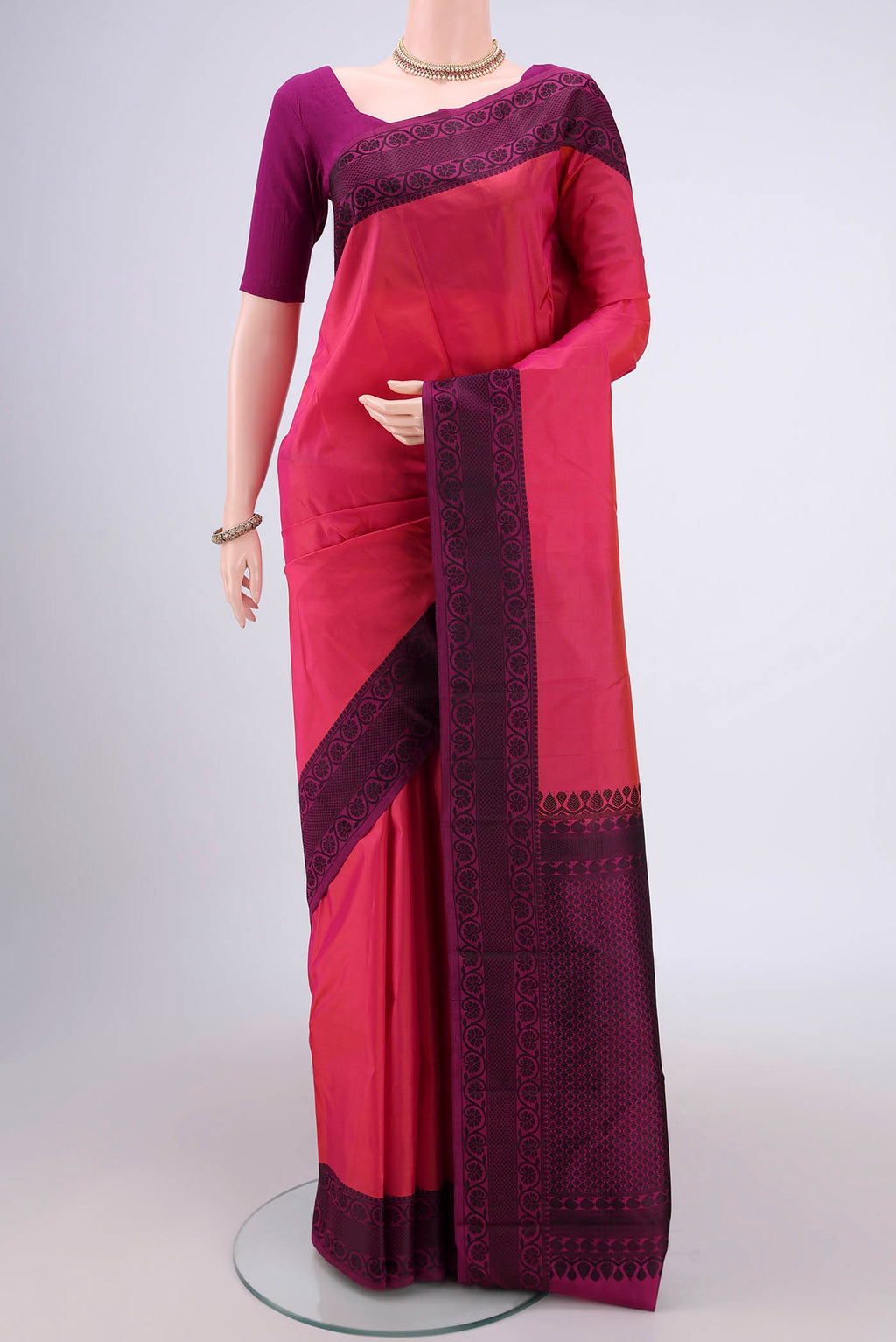 Pink Dual Tone Kanjivaram Silk Saree with Thread Butta on the body and Thread Border.  displayed on a mannequin