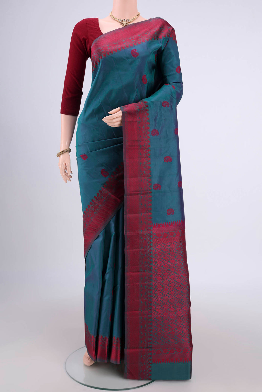 Dark Blue Kanjivaram Silk Saree with Thread Butta on the body and Thread Border.  displayed on a mannequin
