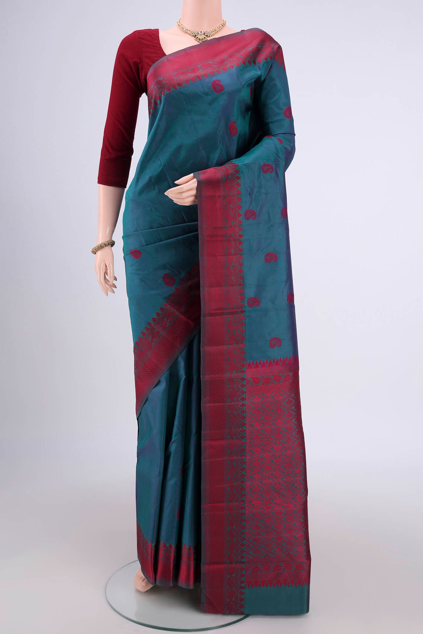 Dark Blue Kanjivaram Silk Saree with Thread Butta on the body and Thread Border.  displayed on a mannequin