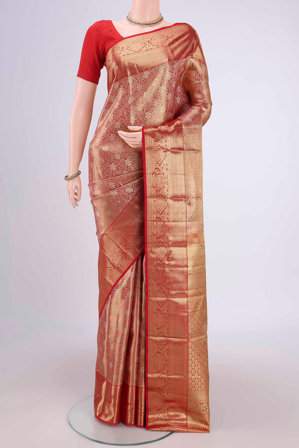 Gold with red Dual Tone Kanjivaram Silk Saree with Zari Brocade on the body and Zari Border.  displayed on a mannequin