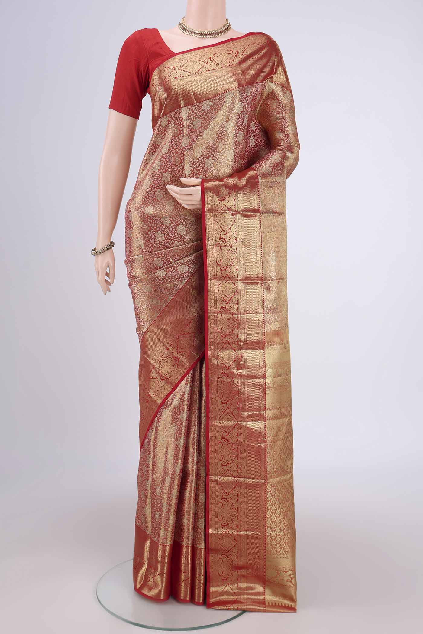 Gold with red Dual Tone Kanjivaram Silk Saree with Zari Brocade on the body and Zari Border.  displayed on a mannequin