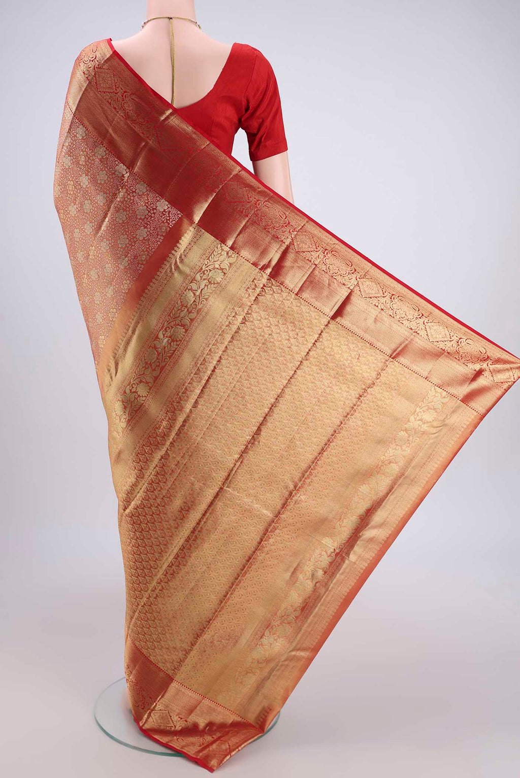 Flat view of Gold with red Dual Tone Kanjivaram Silk Saree with Zari Brocade on the body and Zari Border. 