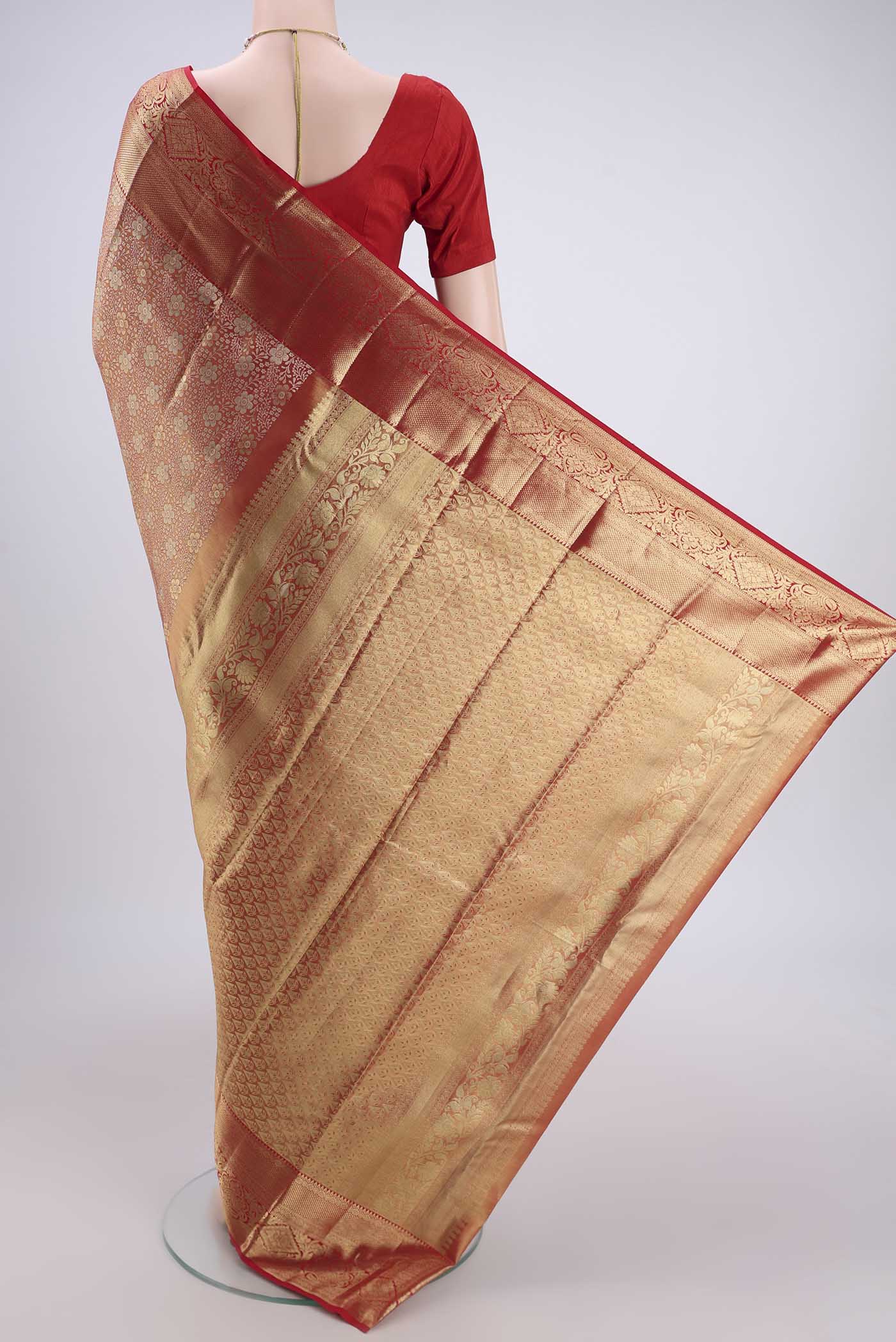 Flat view of Gold with red Dual Tone Kanjivaram Silk Saree with Zari Brocade on the body and Zari Border. 