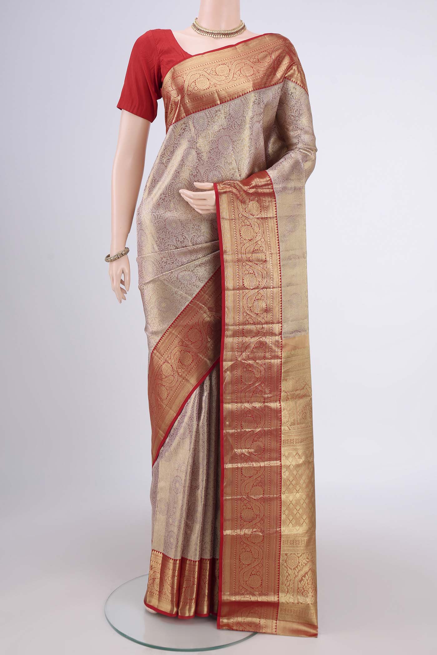 Gold with maroom Dual Tone Kanchipuram Silk Saree with Zari Brocade on the body and Zari Border.  displayed on a mannequin