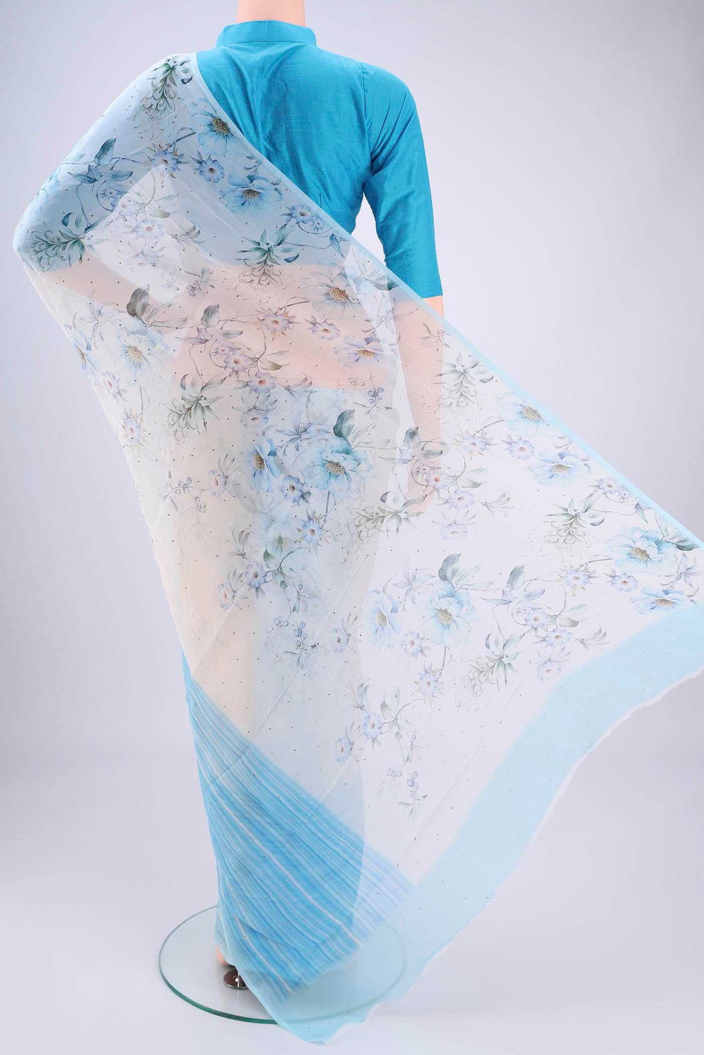 Flat view of White Mysore Chiffon Saree with Floral Print on the body and Sequin Border. 