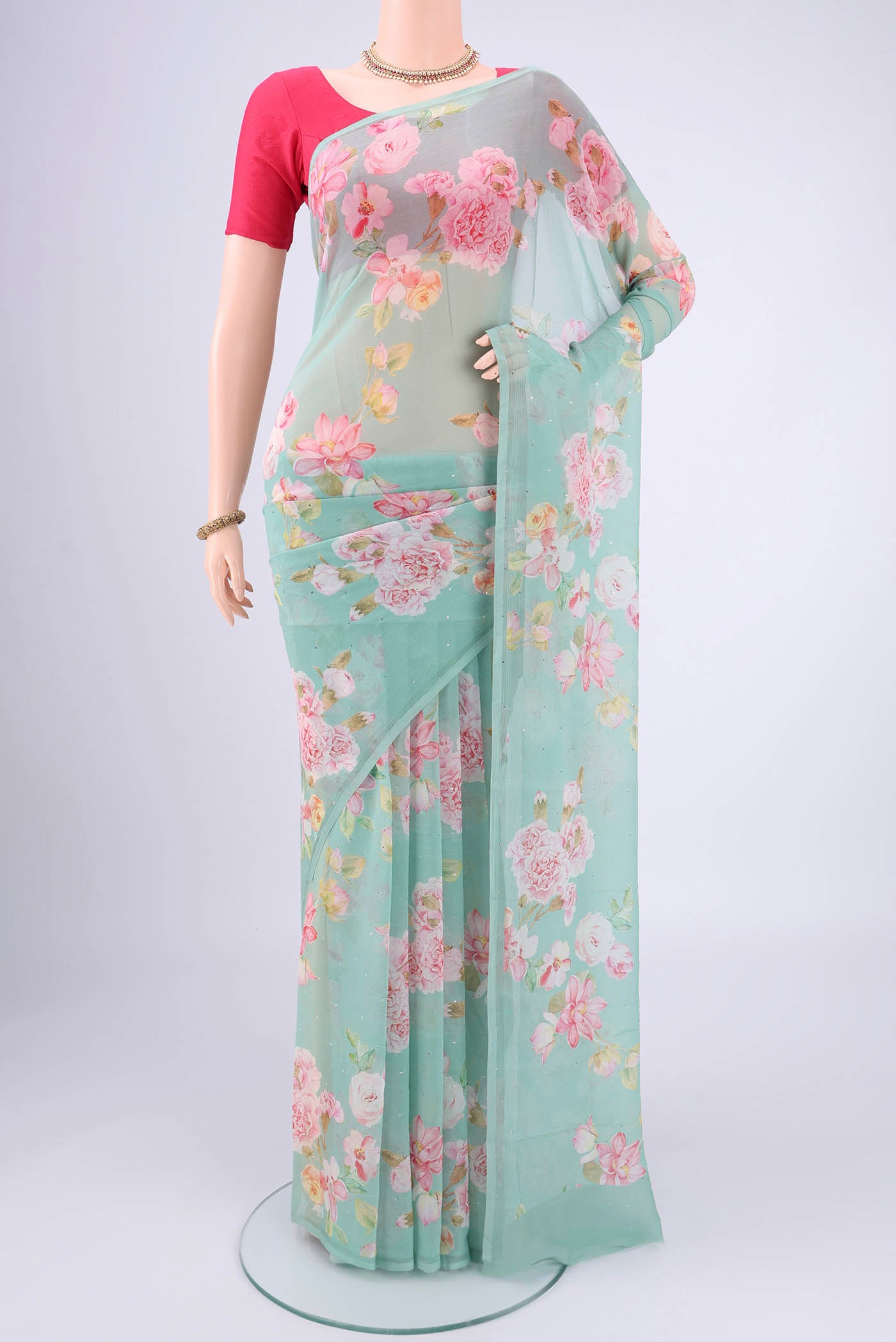 Sea Green Mysore Chiffon Saree with Floral Print on the body and Plain Border.  displayed on a mannequin