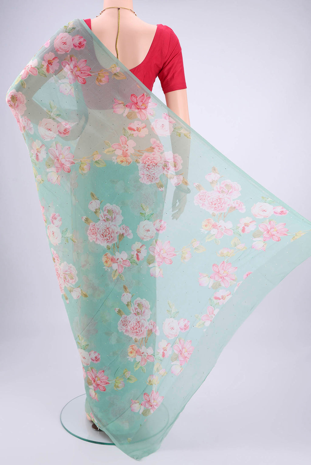 Flat view of Sea Green Mysore Chiffon Saree with Floral Print on the body and Plain Border. 