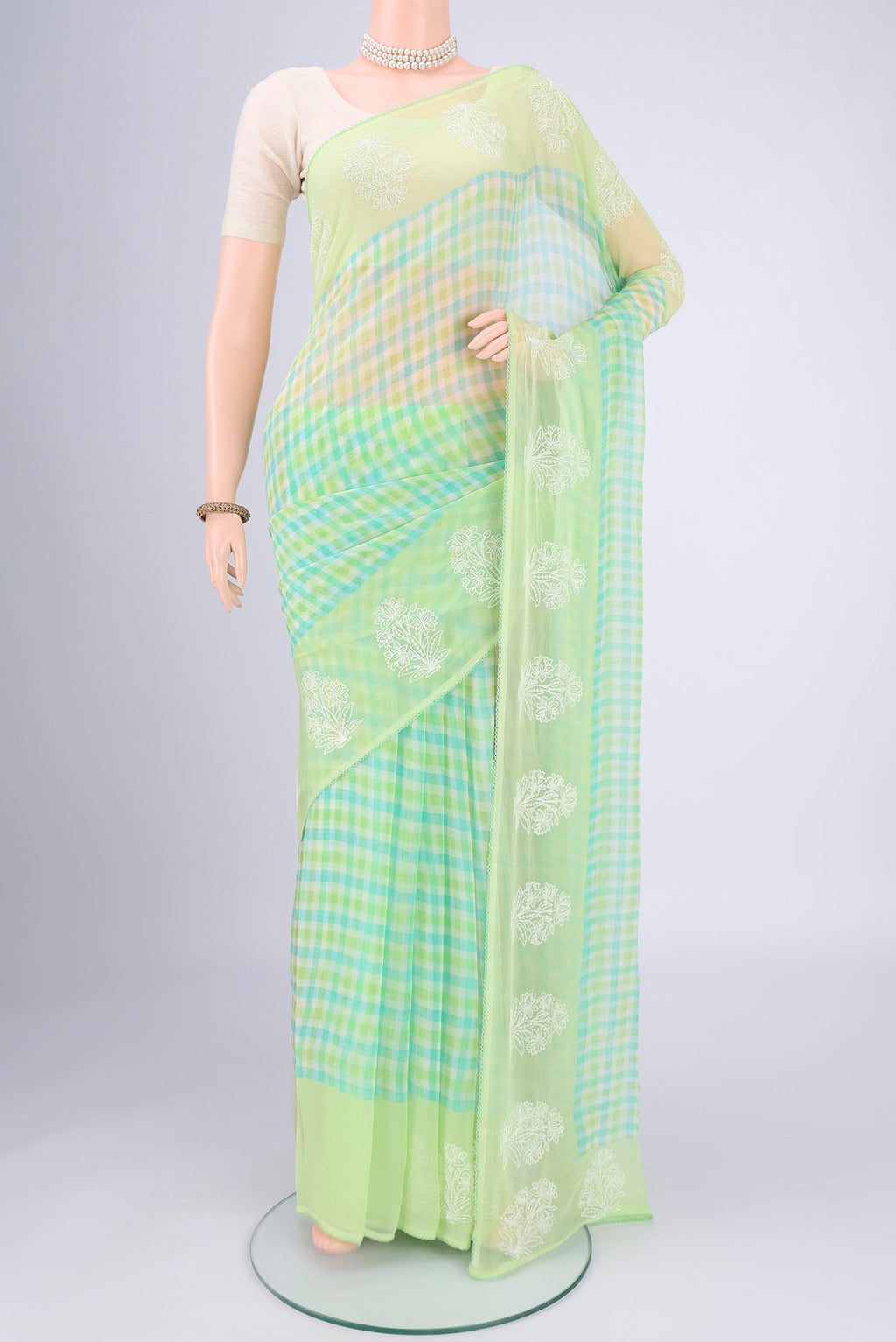 Light Green Mysore Chiffon Saree with Checked design on the body and Thread Border.  displayed on a mannequin