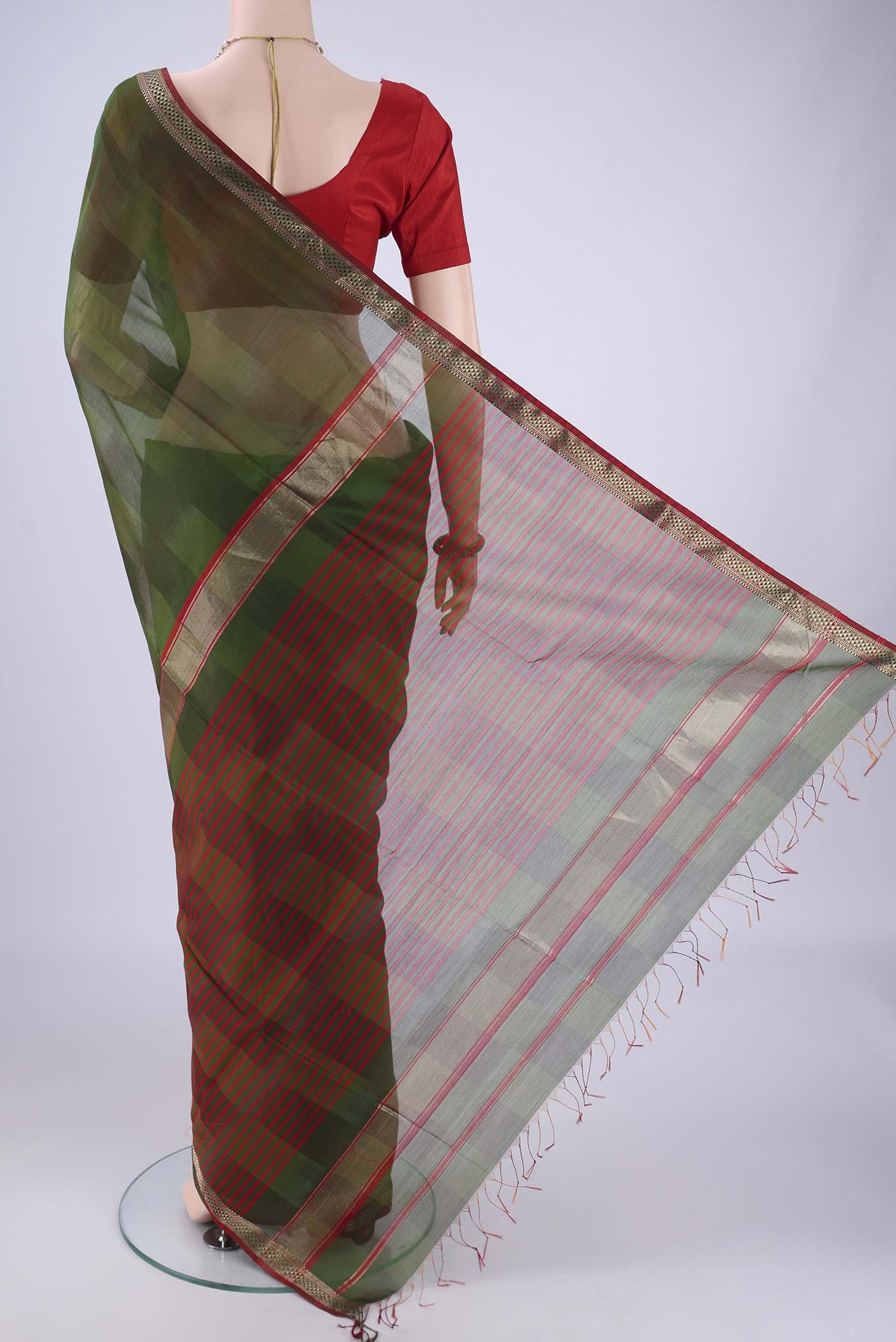 Flat view of Mehandi Green Maheshwari Silk Cotton Saree with Plain Body and Zari Border. 