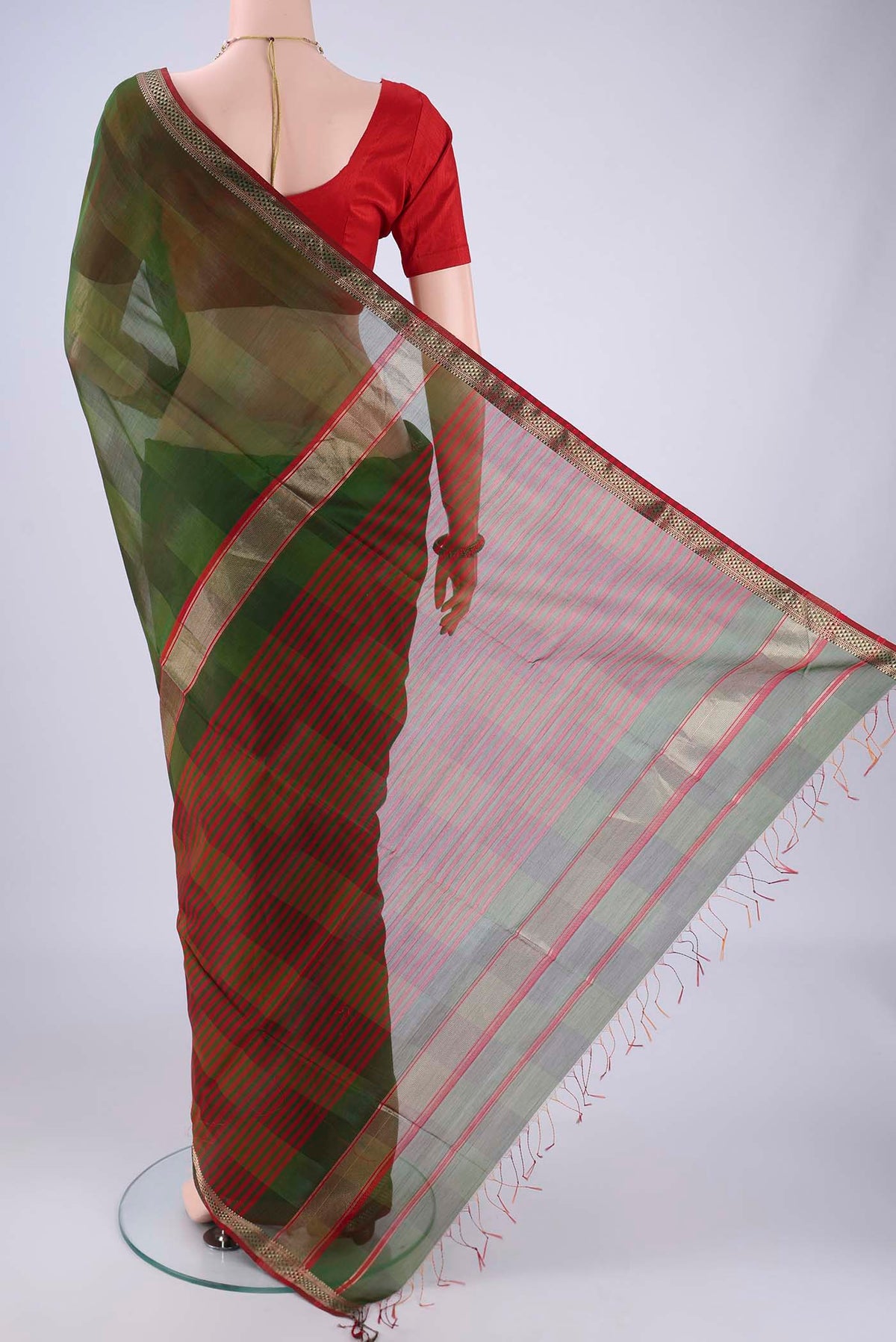 Flat view of Mehandi Green Maheshwari Silk Cotton Saree with Plain Body and Zari Border. 