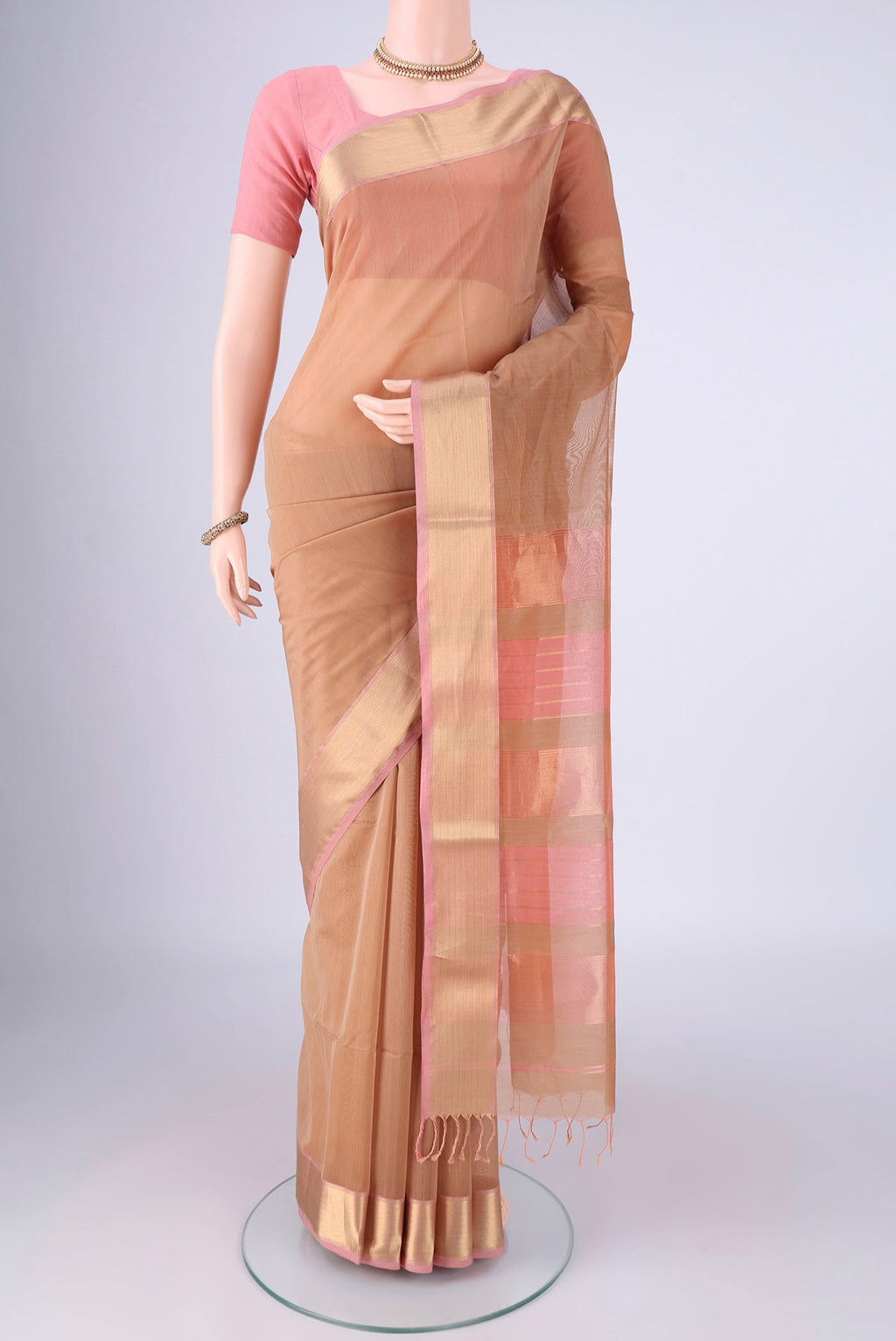 Dark Beige Maheshwari Silk Cotton Saree with Plain Body and Zari Border.  displayed on a mannequin