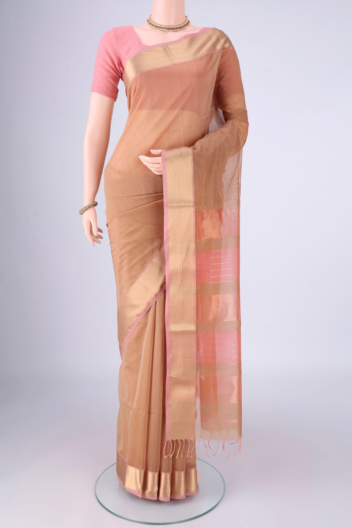Dark Beige Maheshwari Silk Cotton Saree with Plain Body and Zari Border.  displayed on a mannequin
