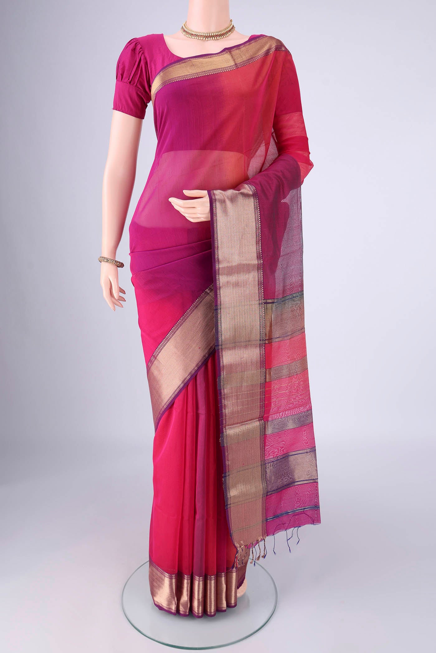 Multi Color Maheshwari Silk Cotton Saree with Plain Body and Zari Border.  displayed on a mannequin