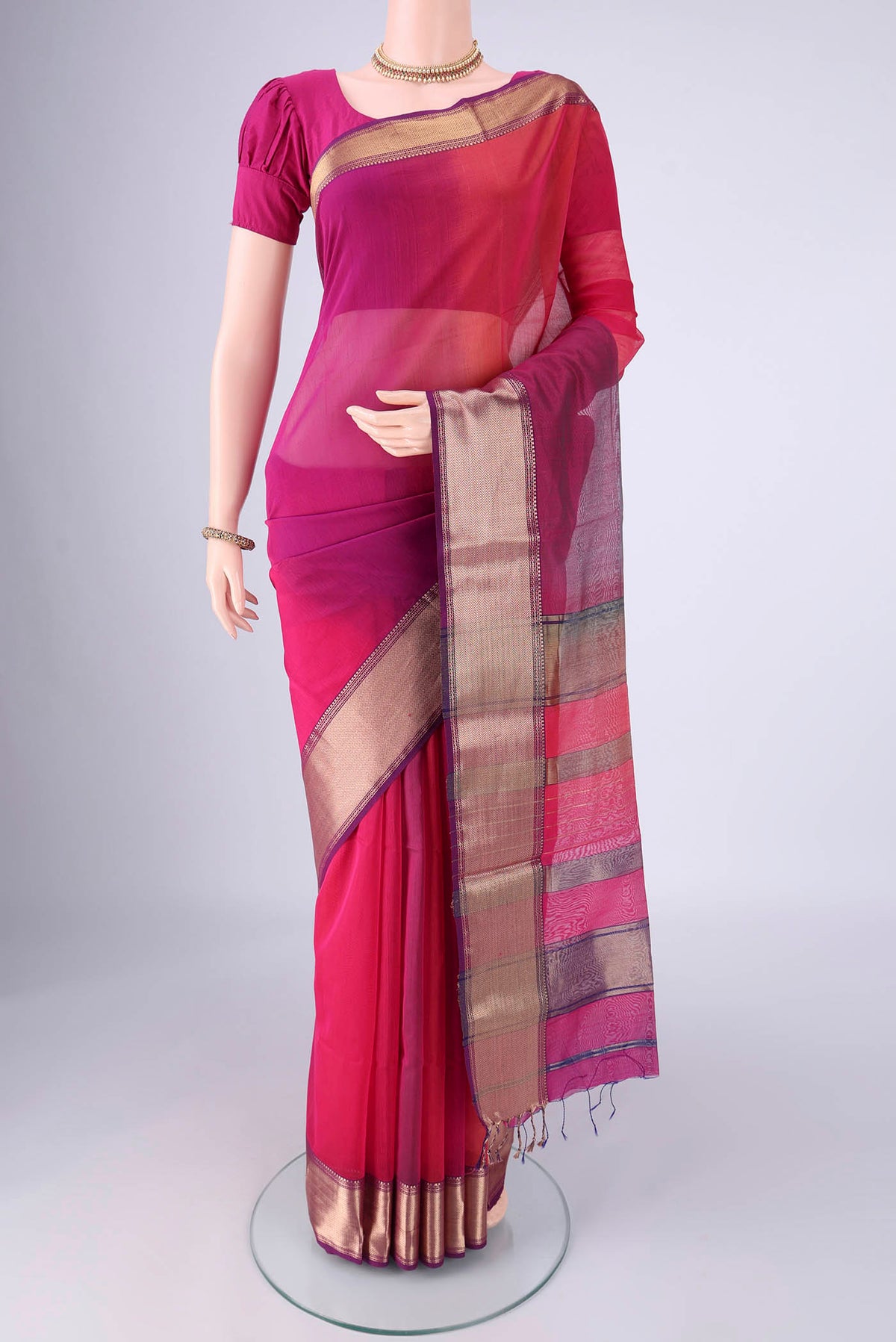 Multi Color Maheshwari Silk Cotton Saree with Plain Body and Zari Border.  displayed on a mannequin