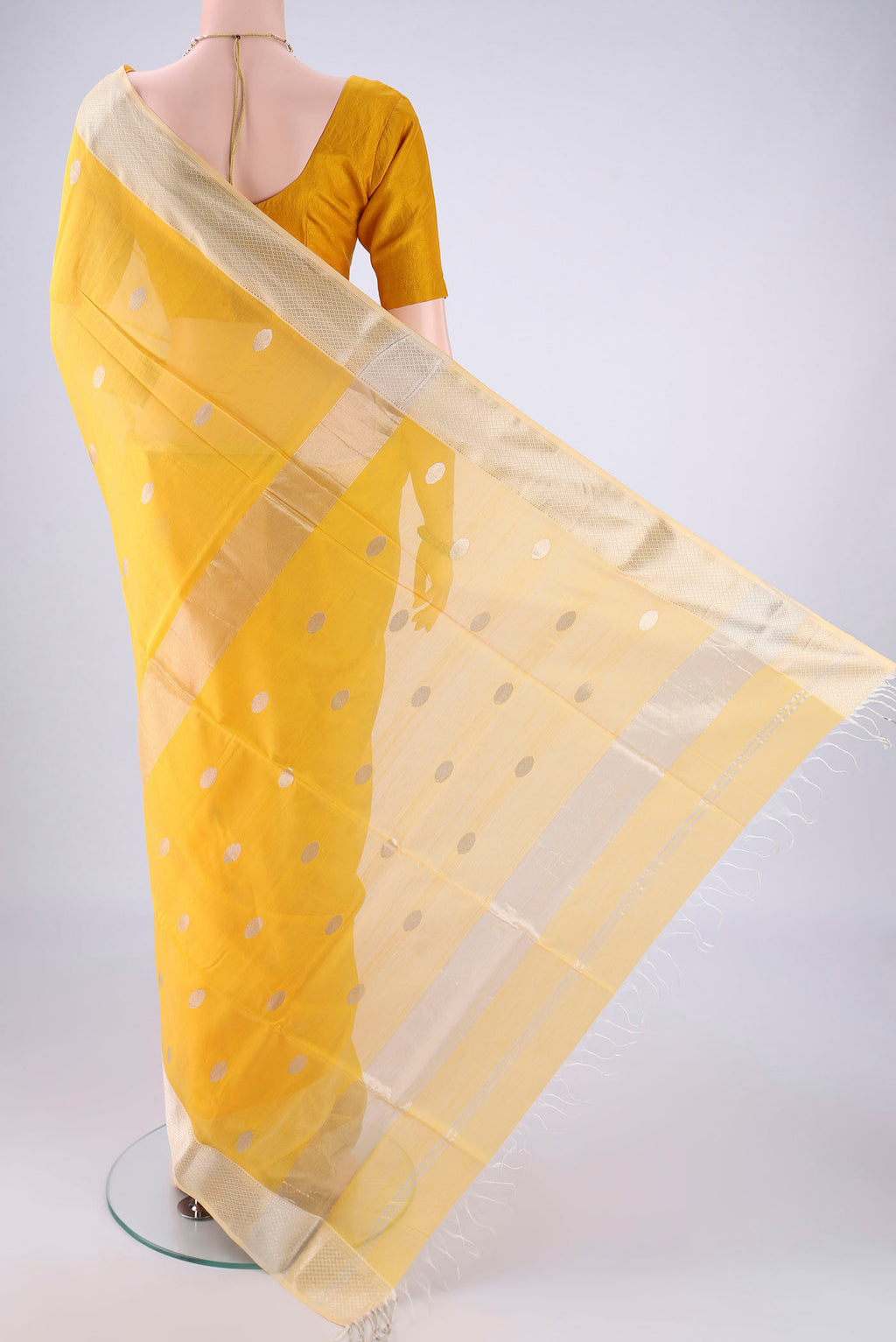 Flat view of Yellow Maheshwari Silk Cotton Saree with Zari Butta on the body and Zari Border. 