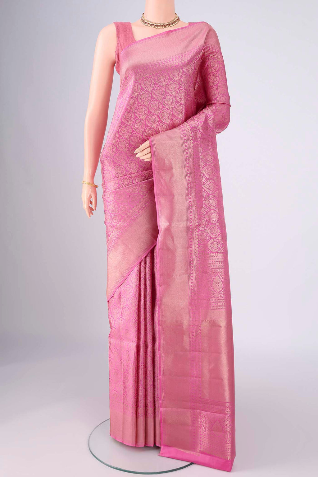Pink Soft Silk Saree with Zari Brocade on the body and Zari Border.  displayed on a mannequin