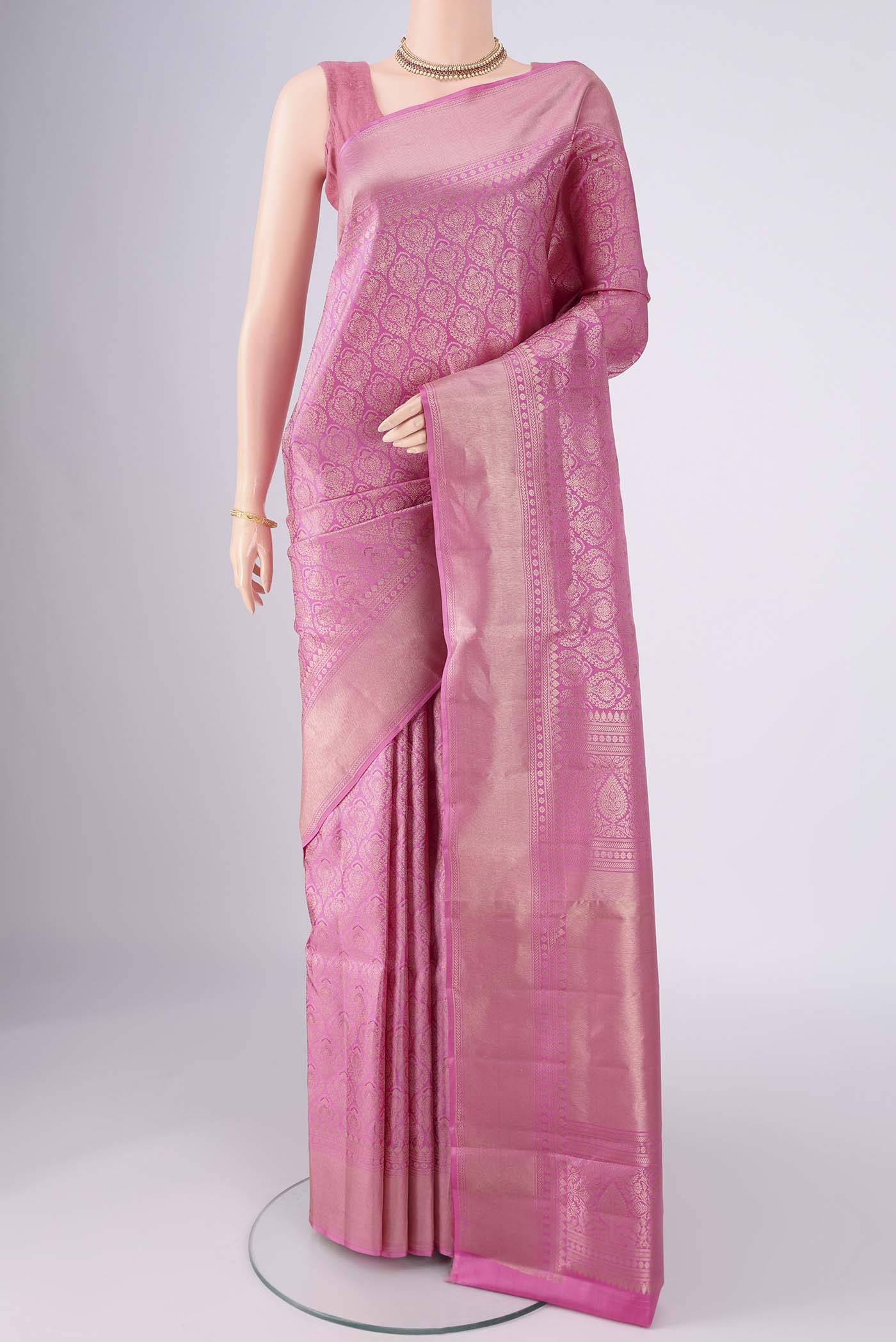 Pink Soft Silk Saree with Zari Brocade on the body and Zari Border.  displayed on a mannequin