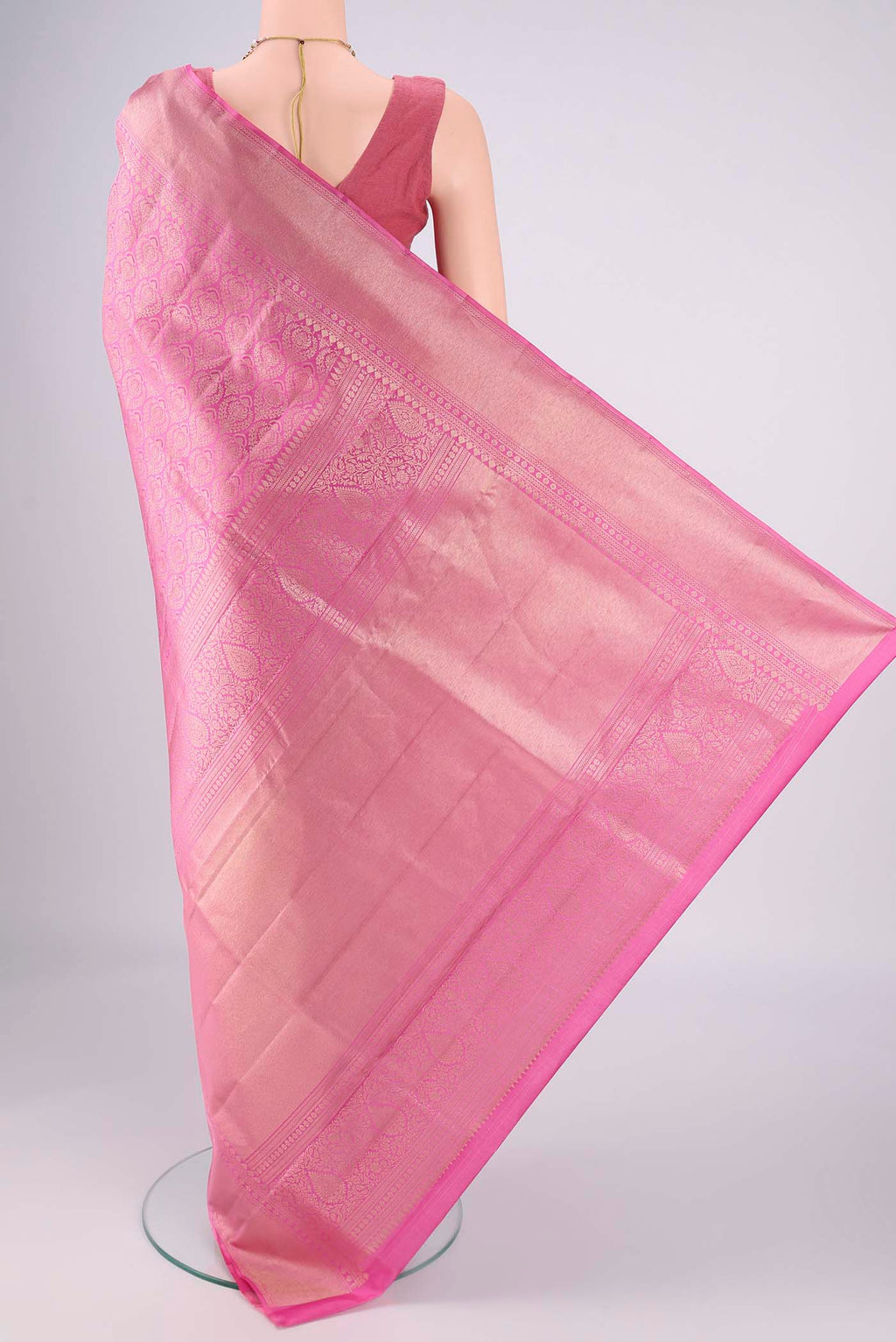 Flat view of Pink Soft Silk Saree with Zari Brocade on the body and Zari Border. 