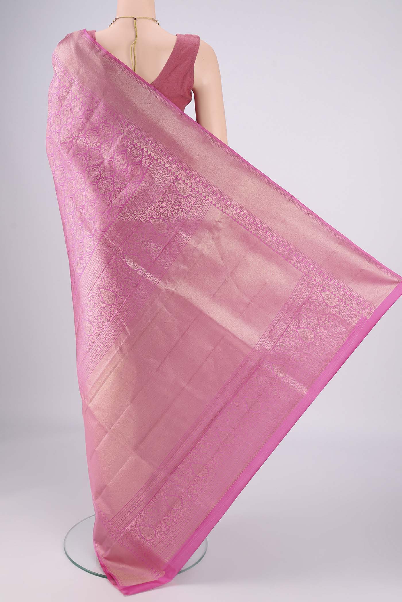 Flat view of Pink Soft Silk Saree with Zari Brocade on the body and Zari Border. 