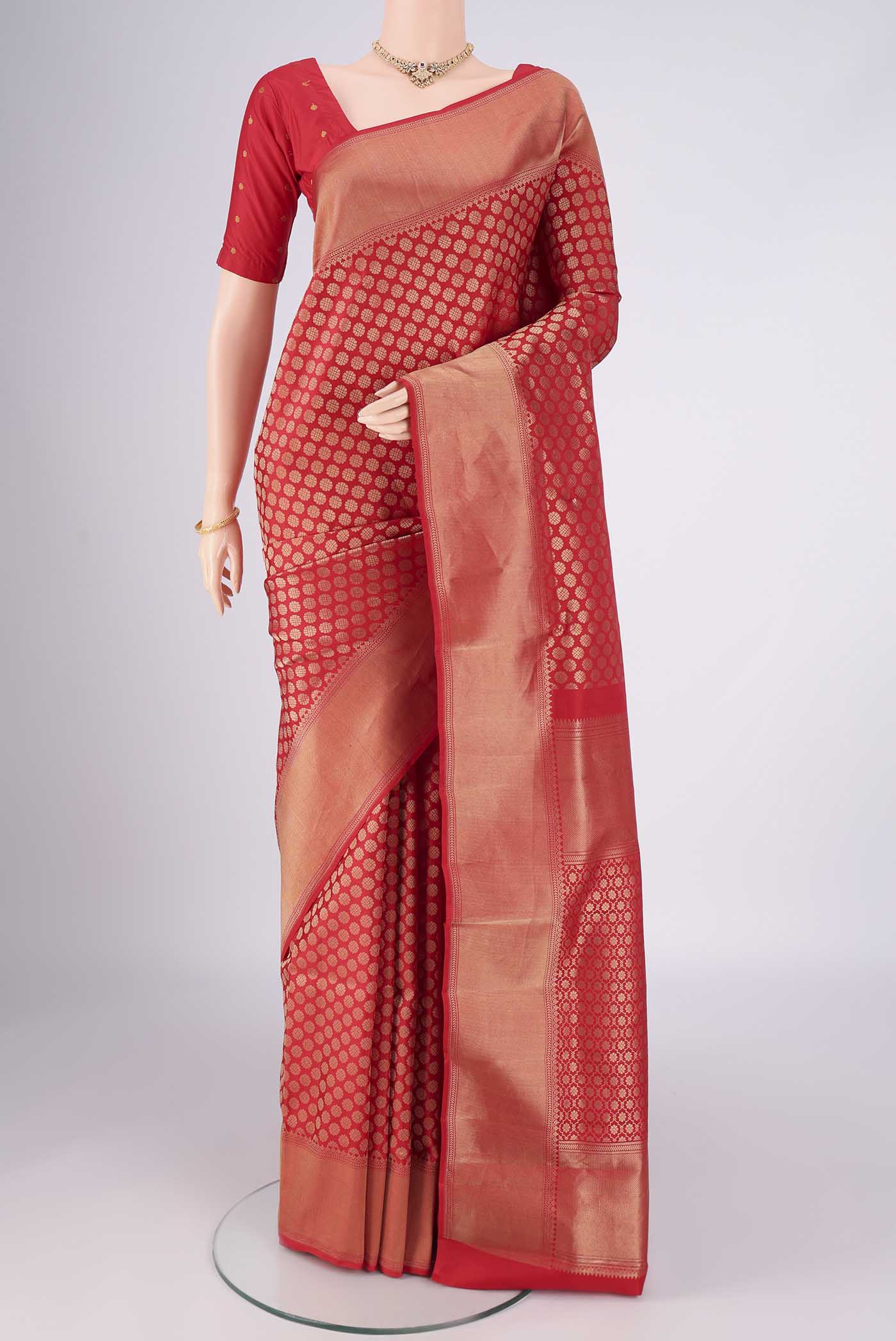 Red Soft Silk Saree with Zari Brocade on the body and Zari Border.  displayed on a mannequin