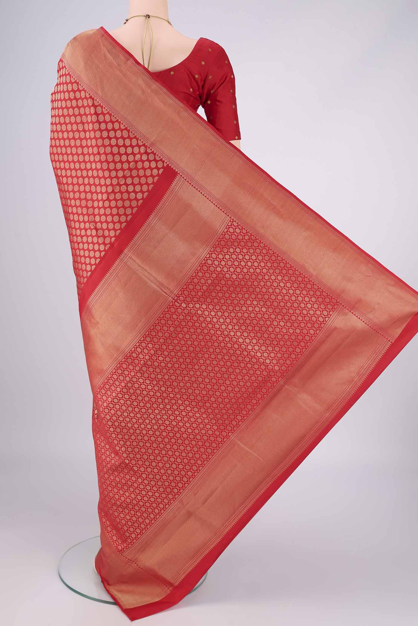 Flat view of Red Soft Silk Saree with Zari Brocade on the body and Zari Border. 