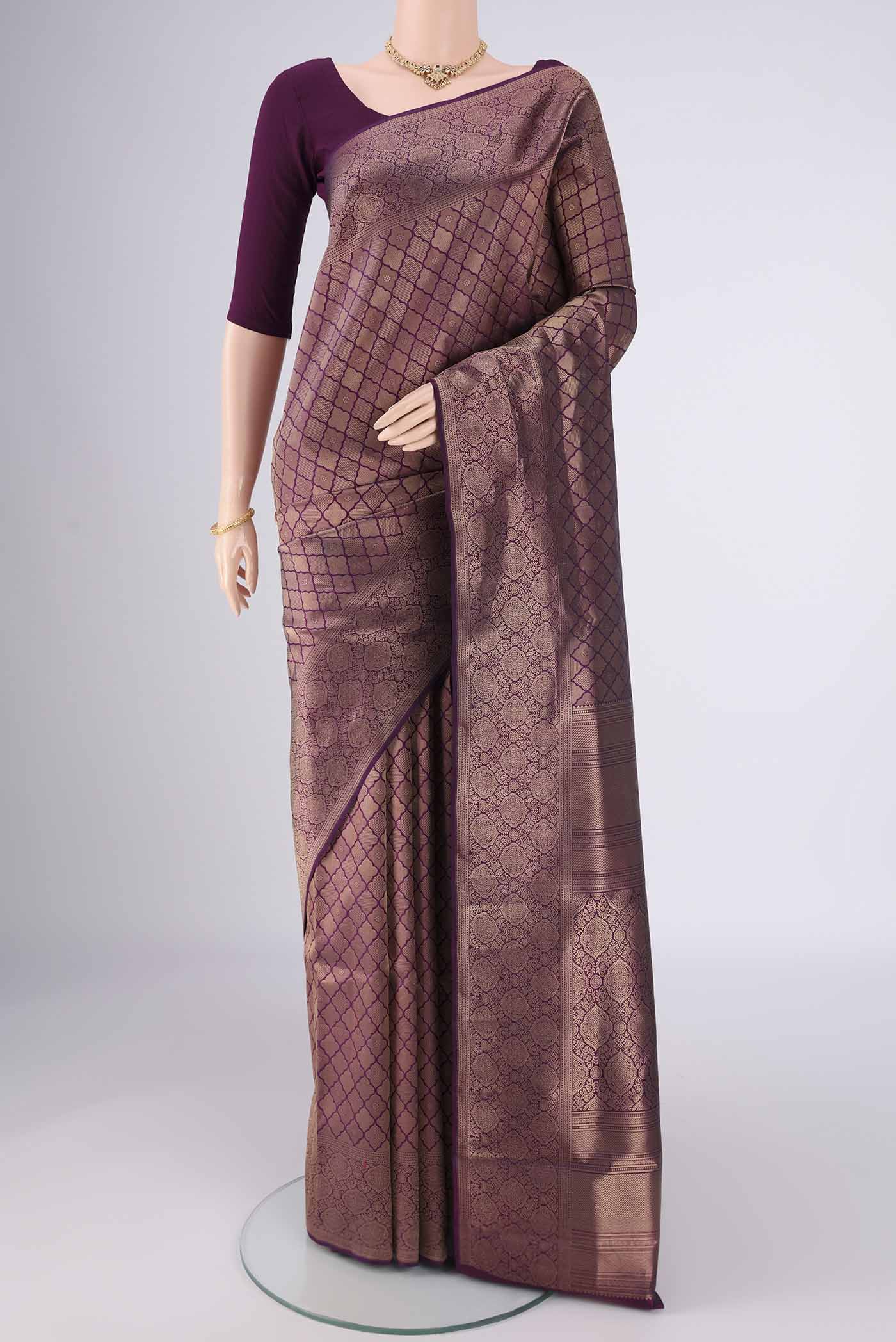 Purple Soft Silk Saree with Zari Brocade on the body and Zari Border.  displayed on a mannequin