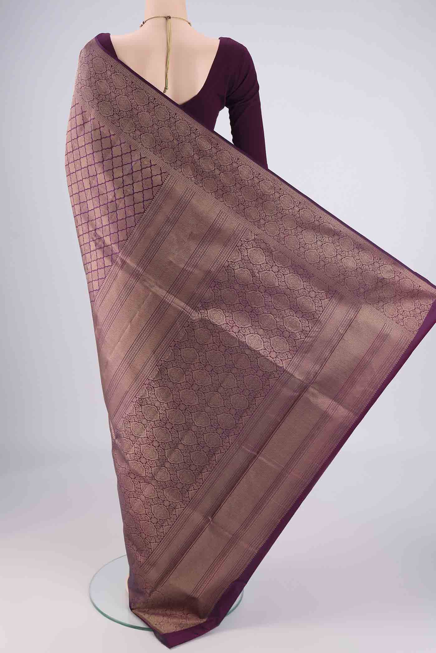 Flat view of Purple Soft Silk Saree with Zari Brocade on the body and Zari Border. 