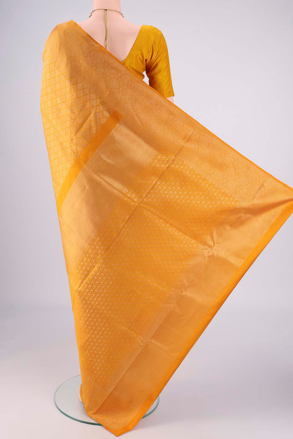 Flat view of Yellow Soft Silk Saree with Zari Brocade on the body and Zari Border. 