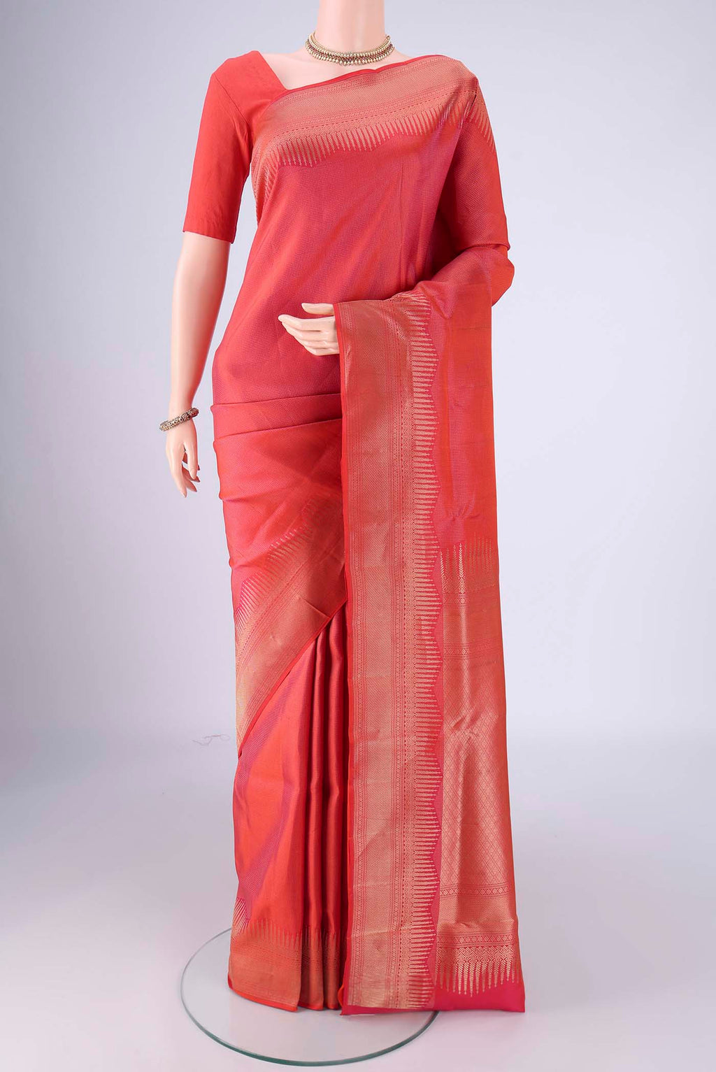 Brick Orange Dual Tone Soft Silk Saree with Zari Brocade on the body and Zari Border.  displayed on a mannequin