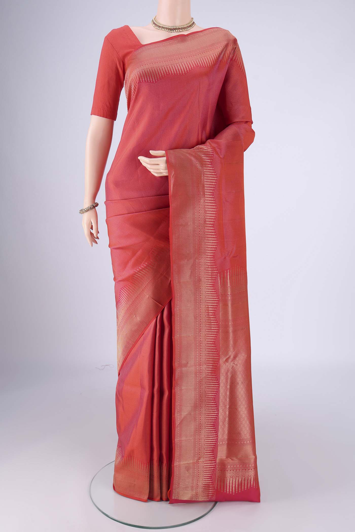 Brick Orange Dual Tone Soft Silk Saree with Zari Brocade on the body and Zari Border.  displayed on a mannequin