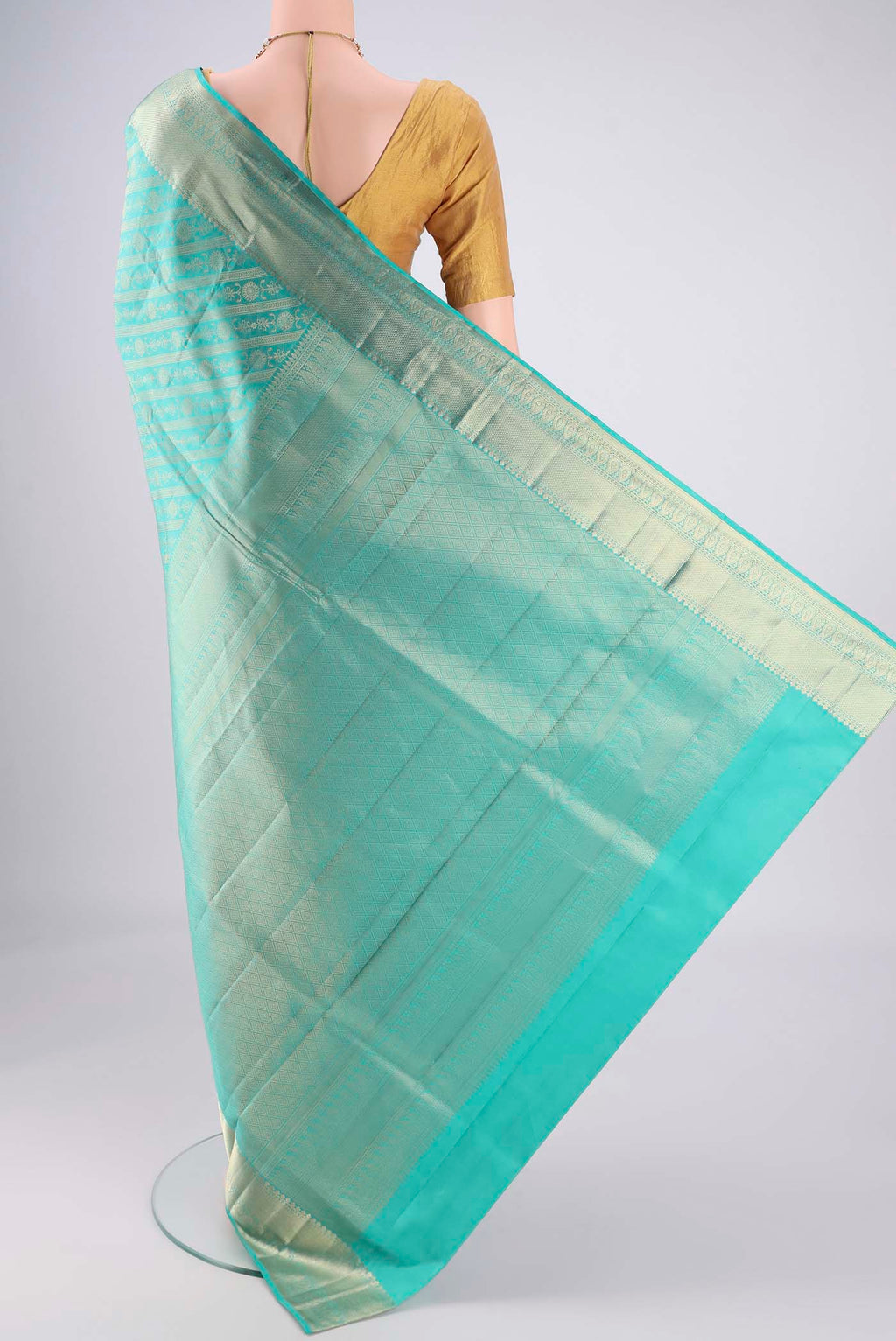 Flat view of Turquoise Soft Silk Saree with Zari Brocade on the body and Zari Border. 